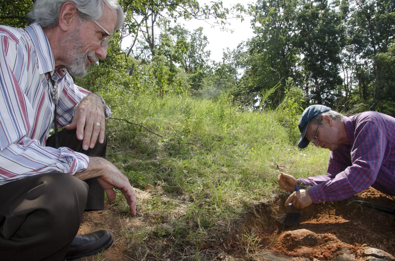 Dinosaur tracker Ray Stanford describes the cretaceous-era nodosaur track he found on the Goddard Space Flight Center campus with Dr. Robert Weems, emeritus paleontologist for the USGS who verified his discovery.  This imprint shows the right rear foot of a nodosaur - a low-slung, spiny leaf-eater - apparently moving in haste as the heel did not fully settle in the cretaceous mud, according to dinosaur tracker Ray Stanford. It was found recently on NASA's Goddard Space Flight Center campus and is being preserved for study.   To read more go to: <a href="http://1.usa.gov/P9NYg7" rel="nofollow">1.usa.gov/P9NYg7</a>  Credit: NASA/GSFC/Rebecca Roth  <b><a href="http://www.nasa.gov/audience/formedia/features/MP_Photo_Guidelines.html" rel="nofollow">NASA image use policy.</a></b>  <b><a href="http://www.nasa.gov/centers/goddard/home/index.html" rel="nofollow">NASA Goddard Space Flight Center</a></b> enables NASA’s mission through four scientific endeavors: Earth Science, Heliophysics, Solar System Exploration, and Astrophysics. Goddard plays a leading role in NASA’s accomplishments by contributing compelling scientific knowledge to advance the Agency’s mission.  <b>Follow us on <a href="http://twitter.com/NASA_GoddardPix" rel="nofollow">Twitter</a></b>  <b>Like us on <a href="http://www.facebook.com/pages/Greenbelt-MD/NASA-Goddard/395013845897?ref=tsd" rel="nofollow">Facebook</a></b>  <b>Find us on <a href="http://instagrid.me/nasagoddard/?vm=grid" rel="nofollow">Instagram</a></b>