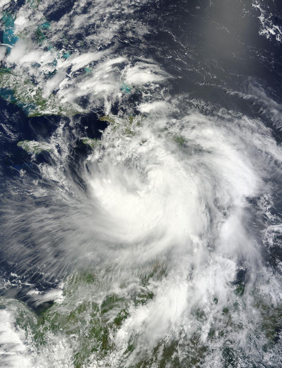 NASA's Terra satellite passed over Tropical Storm Isaac on Aug. 24 at 15:20 UTC (11:20 a.m. EDT) as it continued moving through the eastern Caribbean Sea. The MODIS instrument onboard Aqua captured this visible image.   At 2 p.m. EDT on Aug. 24, Isaac's maximum sustained winds were near 60 mph (95 kmh). The National Hurricane Center noted that Isaac could strengthen later before reaching the coast of Hispaniola tonight, Aug. 24. Hispaniola is an island that contains the Dominican Republic and Haiti. Isaac is located about 135 miles (215 km) south-southeast of Port au Prince, Haiti, near latitude 16.8 north and longitude 71.4 west. Isaac is now moving toward the northwest near 14 mph (22 kmh).  Isaac is expected to reach hurricane status over the weekend of Aug. 25-26 and NASA satellites will continue providing valuable temperature, rainfall, visible and infrared data.  Text Credit: Rob Gutro NASA's Goddard Space Flight Center, Greenbelt, Md.  <b>To read more go to: <a href="http://www.nasa.gov/mission_pages/hurricanes/archives/2012/h2012_Isaac.html" rel="nofollow">www.nasa.gov/mission_pages/hurricanes/archives/2012/h2012...</a></b>  Credit: NASA Goddard MODIS Rapid Response Team  <b><a href="http://www.nasa.gov/audience/formedia/features/MP_Photo_Guidelines.html" rel="nofollow">NASA image use policy.</a></b>  <b><a href="http://www.nasa.gov/centers/goddard/home/index.html" rel="nofollow">NASA Goddard Space Flight Center</a></b> enables NASA’s mission through four scientific endeavors: Earth Science, Heliophysics, Solar System Exploration, and Astrophysics. Goddard plays a leading role in NASA’s accomplishments by contributing compelling scientific knowledge to advance the Agency’s mission.  <b>Follow us on <a href="http://twitter.com/NASA_GoddardPix" rel="nofollow">Twitter</a></b>  <b>Like us on <a href="http://www.facebook.com/pages/Greenbelt-MD/NASA-Goddard/395013845897?ref=tsd" rel="nofollow">Facebook</a></b>  <b>Find us on <a href="http://instagrid.me/nasagoddard/?vm=grid" rel="nofollow">Instagram</a></b>