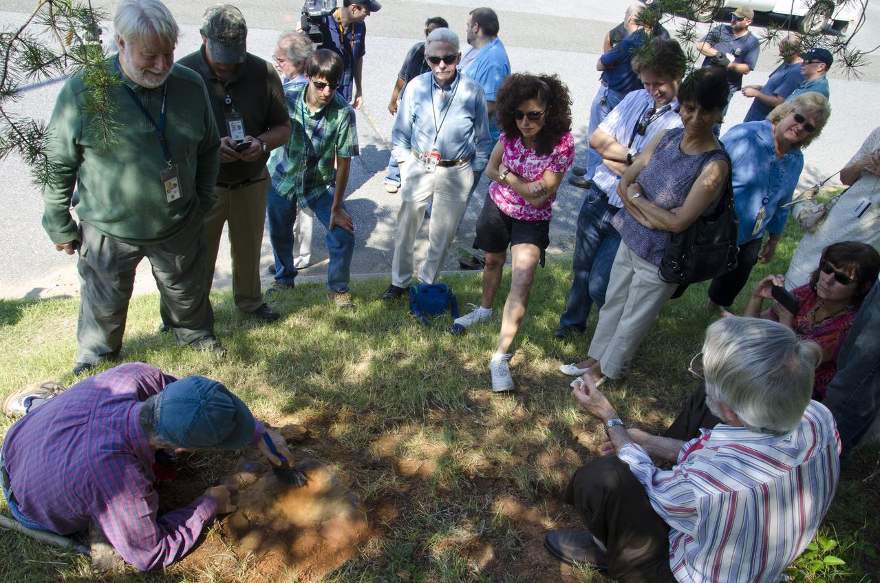 Dr. Robert Weems, emeritus paleontologist for the USGS verifies the recently discovered dinosaur track found on the NASA Goddard Space Flight Center campus.  This imprint shows the right rear foot of a nodosaur - a low-slung, spiny leaf-eater - apparently moving in haste as the heel did not fully settle in the cretaceous mud, according to dinosaur tracker Ray Stanford. It was found recently on NASA's Goddard Space Flight Center campus and is being preserved for study.   To read more about this discovery go to: <a href="http://1.usa.gov/P9NYg7" rel="nofollow">1.usa.gov/P9NYg7</a>  Credit: NASA/GSFC/Rebecca Roth  <b><a href="http://www.nasa.gov/audience/formedia/features/MP_Photo_Guidelines.html" rel="nofollow">NASA image use policy.</a></b>  <b><a href="http://www.nasa.gov/centers/goddard/home/index.html" rel="nofollow">NASA Goddard Space Flight Center</a></b> enables NASA’s mission through four scientific endeavors: Earth Science, Heliophysics, Solar System Exploration, and Astrophysics. Goddard plays a leading role in NASA’s accomplishments by contributing compelling scientific knowledge to advance the Agency’s mission.  <b>Follow us on <a href="http://twitter.com/NASA_GoddardPix" rel="nofollow">Twitter</a></b>  <b>Like us on <a href="http://www.facebook.com/pages/Greenbelt-MD/NASA-Goddard/395013845897?ref=tsd" rel="nofollow">Facebook</a></b>  <b>Find us on <a href="http://instagrid.me/nasagoddard/?vm=grid" rel="nofollow">Instagram</a></b>