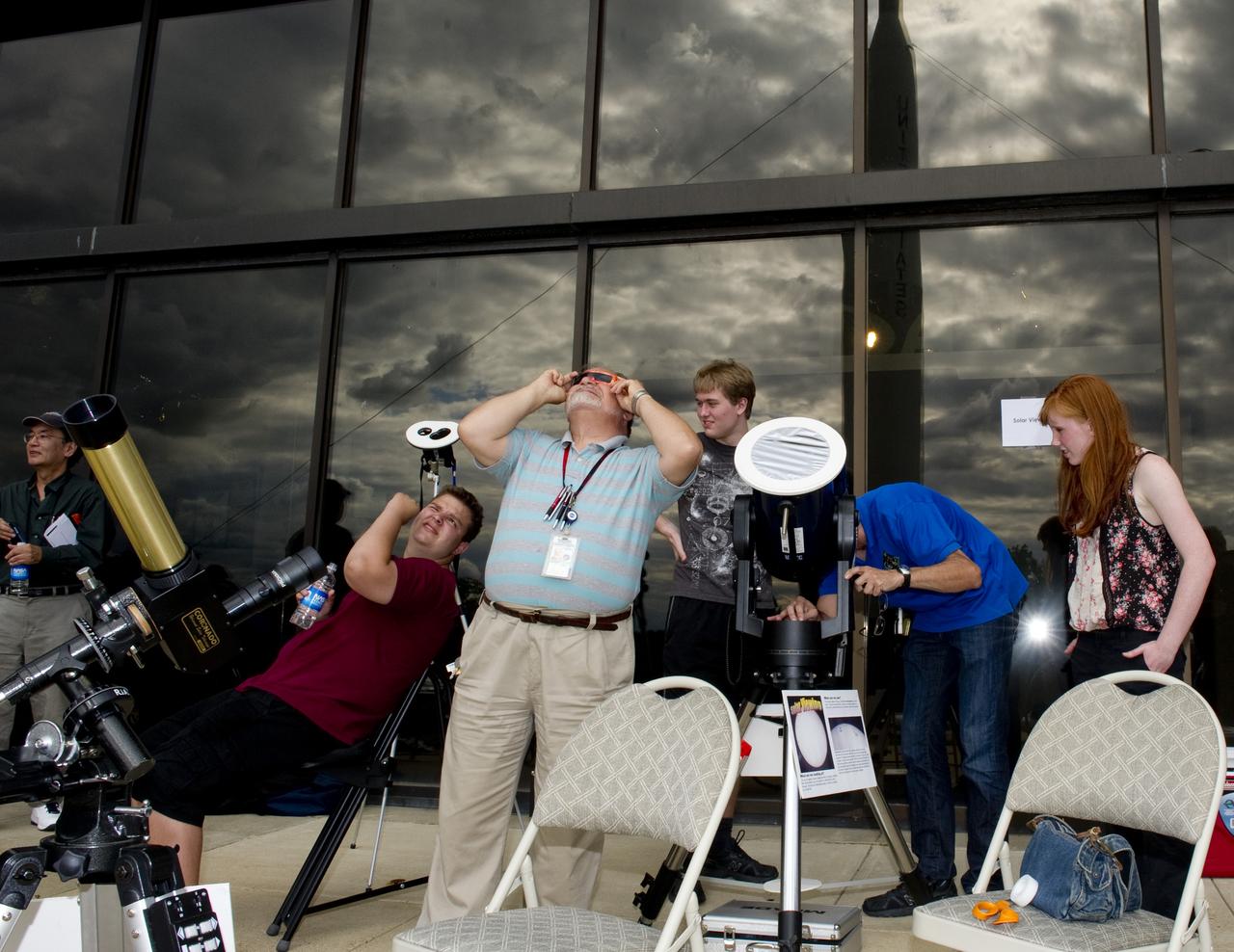 A &quot;transit of Venus&quot; occurs when the planet Venus passes directly between the sun and the Earth. During the event, Venus will be seen from Earth as a small black sphere moving across the face of the sun.  Such an event won’t occur again until the year 2117.  The Goddard Visitor Center hosted a watch party that included near real-time images from NASA’s Solar Dynamics Observatory mission, coverage of the event from several locations via NASA TV, in-person presentations by NASA experts, hands-on activities for children of all ages. Heavy cloud cover did not allow viewing opportunities of the transit via solar telescopes.   Credit: NASA/Goddard Space Flight Center/Bill Hrybyk  <b><a href="http://www.nasa.gov/audience/formedia/features/MP_Photo_Guidelines.html" rel="nofollow">NASA image use policy.</a></b>  <b><a href="http://www.nasa.gov/centers/goddard/home/index.html" rel="nofollow">NASA Goddard Space Flight Center</a></b> enables NASA’s mission through four scientific endeavors: Earth Science, Heliophysics, Solar System Exploration, and Astrophysics. Goddard plays a leading role in NASA’s accomplishments by contributing compelling scientific knowledge to advance the Agency’s mission.  <b>Follow us on <a href="http://twitter.com/NASA_GoddardPix" rel="nofollow">Twitter</a></b>  <b>Like us on <a href="http://www.facebook.com/pages/Greenbelt-MD/NASA-Goddard/395013845897?ref=tsd" rel="nofollow">Facebook</a></b>  <b>Find us on <a href="http://instagrid.me/nasagoddard/?vm=grid" rel="nofollow">Instagram</a></b>