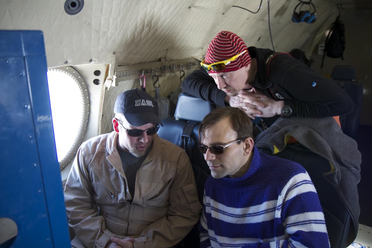 James Jacobson, a Data Analyst based out of Ames Research Center, explains his Digital Mapping System instrument to two teachers flying with Operation IceBridge, (top to bottom) Tom Koch Svennesen, of Greenland, and Peter Gross, of Denmark, on April 14, 2012. Credit: NASA/Jefferson Beck ============= IceBridge, a six-year NASA mission, is the largest airborne survey of Earth's polar ice ever flown. It will yield an unprecedented three-dimensional view of Arctic and Antarctic ice sheets, ice shelves and sea ice. These flights will provide a yearly, multi-instrument look at the behavior of the rapidly changing features of the Greenland and Antarctic ice. To read more about this mission go to: <a href="http://www.nasa.gov/mission_pages/icebridge/index.html" rel="nofollow">www.nasa.gov/mission_pages/icebridge/index.html</a> <b><a href="http://www.nasa.gov/audience/formedia/features/MP_Photo_Guidelines.html" rel="nofollow">NASA image use policy.</a></b> <b><a href="http://www.nasa.gov/centers/goddard/home/index.html" rel="nofollow">NASA Goddard Space Flight Center</a></b> enables NASA’s mission through four scientific endeavors: Earth Science, Heliophysics, Solar System Exploration, and Astrophysics. Goddard plays a leading role in NASA’s accomplishments by contributing compelling scientific knowledge to advance the Agency’s mission. <b>Follow us on <a href="http://twitter.com/NASA_GoddardPix" rel="nofollow">Twitter</a></b> <b>Like us on <a href="http://www.facebook.com/pages/Greenbelt-MD/NASA-Goddard/395013845897?ref=tsd" rel="nofollow">Facebook</a></b> <b>Find us on <a href="http://instagrid.me/nasagoddard/?vm=grid" rel="nofollow">Instagram</a></b>