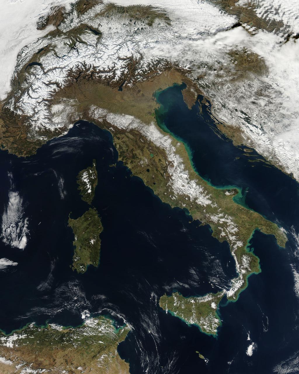 NASA image acquired February 24, 2012  By late February, 2012, the great European cold wave had begun to loosen its frigid grip, but significant snow still remained in the region. The Moderate Resolution Imaging Spectroradiometer (MODIS) aboard the Aqua satellite captured this true-color image of snow in Italy on February 24 at 12:35 UTC (1:30 p.m. local time).  In the north of the image, bright white clouds blanket the region in a broad arc. Snow, which tends to be generally less bright that clouds, covers the Alps in the north of Italy. The Apennine Mountains, which form the backbone of the Italian peninsula, also carry a blanket of snow. Although clouds and snow can, at times, be distinguished visually in a true-color image, sometimes they can appear very similar. When it is important to clearly define snow from cloud, false color images are often helpful.  Rome, which can be seen as a gray smudge on the southwestern coast of the peninsula, recorded highs of a spring-like 50°F the day this image was captured, but earlier in the month the temperatures dove as low as 26°F on February 5. During that cold snap a rare intense snowfall blanketed Rome, causing the closure of the Colosseum, the Roman Forum and the Palatine Hill due to concerns of the risk of icy footing for tourists, and roads became impassible.  Further north, temperatures plummeted to −21 °C (−6 °F) on 7 February. On February 11, news media reported over 2 meters (6.5 feet) of snow had fallen in Urbino, a walled town situated on a high sloping hillside on the eastern side of the Apennine Mountains. That same snowfall cut access to many remote towns in the Apennines, blocking roads and trapping some people in the homes.  Credit: NASA/GSFC/Jeff Schmaltz/MODIS Land Rapid Response Team  <b><a href="http://www.nasa.gov/centers/goddard/home/index.html" rel="nofollow">NASA Goddard Space Flight Center</a></b> enables NASA’s mission through four scientific endeavors: Earth Science, Heliophysics, Solar System Exploration, and Astrophysics. Goddard plays a leading role in NASA’s accomplishments by contributing compelling scientific knowledge to advance the Agency’s mission.  <b>Follow us on <a href="http://twitter.com/NASA_GoddardPix" rel="nofollow">Twitter</a></b>  <b>Like us on <a href="http://www.facebook.com/pages/Greenbelt-MD/NASA-Goddard/395013845897?ref=tsd" rel="nofollow">Facebook</a></b>  <b>Find us on <a href="http://instagrid.me/nasagoddard/?vm=grid" rel="nofollow">Instagram</a></b>