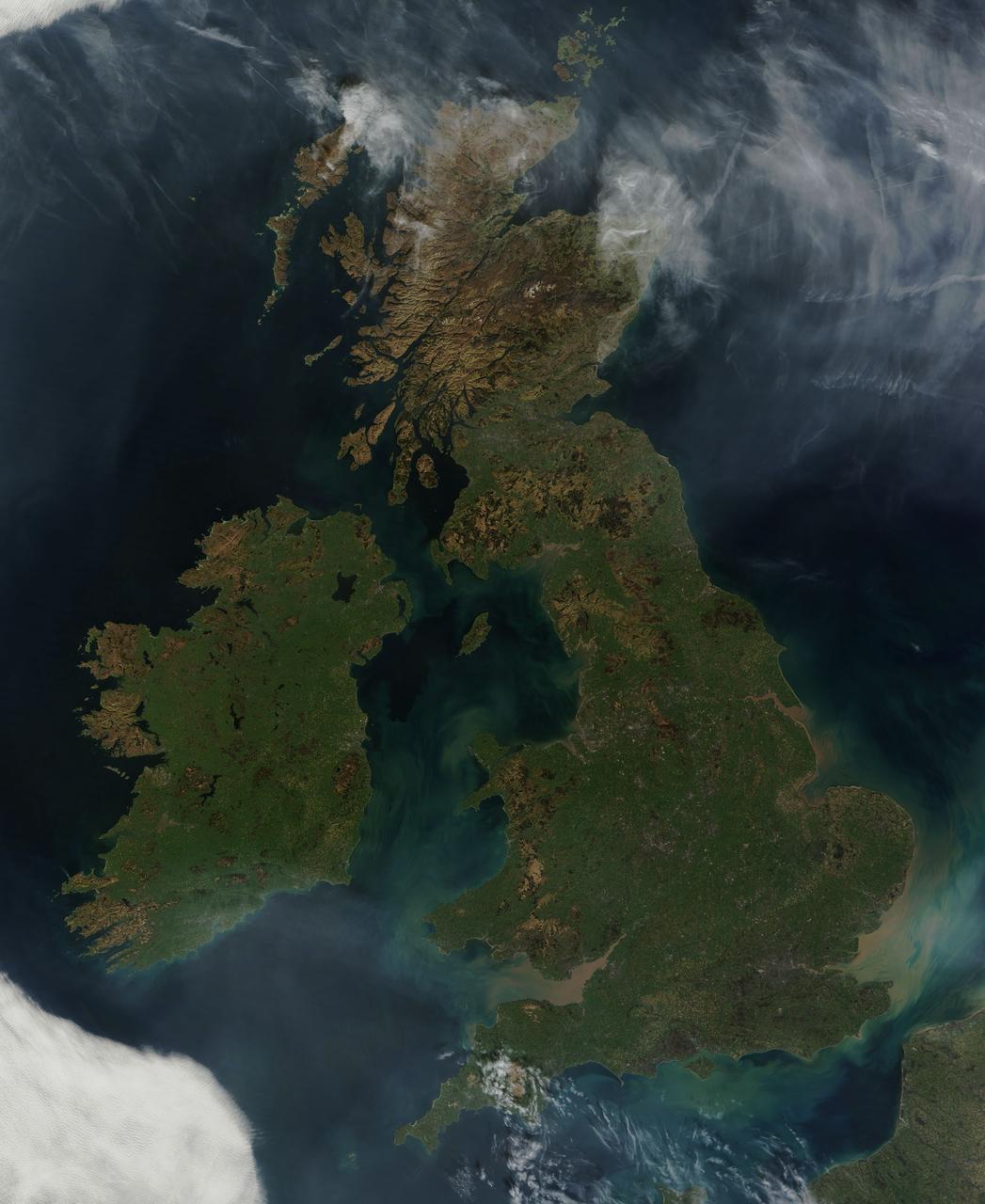 NASA image acquired March 26, 2012 This nearly cloud-free view of Great Britain and Ireland was acquired by the Moderate Resolution Imaging Spectroradiometer (MODIS) aboard NASA’s Terra satellite on March 26, 2012. Just a few days into spring, most of the land appears green, although not quite as brilliant as the summertime hues that give Ireland the nickname “the Emerald Island”. The islands of Ireland (west) and Great Britain (east) are separated by the Irish Sea, which is filled with the turquoise, green and tan swirls typical of sediment, although blooming algae could also contribute some color to the waters. To the southeast, the English Channel separates the island of Great Britain from France (south) and Belgium (north). London can be seen as a gray circle situated inland on the tan-colored River Thames. The sediment from the Thames flows into the English Channel due east of London. The United Kingdom is made up of Wales, Scotland and England, all located primarily on the island of Great Britain, and of Northern Ireland, which comprises the northern section of the island of Ireland. Dublin, in the Republic of Ireland, can be seen as a gray smudge on the eastern coast of the island. Almost due west Galway can be seen as a linear gray streak on the northern coast of Galway Bay, with the blue waters of Loch Corrib to the north. Most of the United Kingdom and Ireland are part of the Celtic broadleaf forest ecoregion, where acid-loving oak and mixed oak forests abound, along with fen and swamp forests and ombrotrophic mires. A portion of the Scottish Highlands, in the north of Great Britain, are covered by the Caledon conifer forest ecoregion. The Caledonia conifers once covered a large area of Scotland, but now only about 1% of the original forest survives, mostly high in the cooler areas of the Highlands. NASA/GSFC/Jeff Schmaltz/MODIS Land Rapid Response Team <b><a href="http://www.nasa.gov/audience/formedia/features/MP_Photo_Guidelines.html" rel="nofollow">NASA image use policy.</a></b> <b><a href="http://www.nasa.gov/centers/goddard/home/index.html" rel="nofollow">NASA Goddard Space Flight Center</a></b> enables NASA’s mission through four scientific endeavors: Earth Science, Heliophysics, Solar System Exploration, and Astrophysics. Goddard plays a leading role in NASA’s accomplishments by contributing compelling scientific knowledge to advance the Agency’s mission. <b>Follow us on <a href="http://twitter.com/NASA_GoddardPix" rel="nofollow">Twitter</a></b> <b>Like us on <a href="http://www.facebook.com/pages/Greenbelt-MD/NASA-Goddard/395013845897?ref=tsd" rel="nofollow">Facebook</a></b> <b>Find us on <a href="http://instagrid.me/nasagoddard/?vm=grid" rel="nofollow">Instagram</a></b>