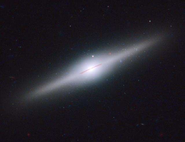 NASA image: NASA's Hubble Spots a Relic from a Shredded Galaxy