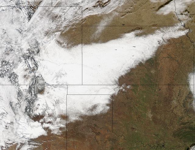 Winter arrived officially on Dec. 22 at 12:35 a.m. EST, but the U.S. Plains states received an early and cool welcome on Dec. 19 from heavy snowfall that was seen by a NASA satellite.   NASA's Aqua satellite passed overhead on Dec. 21 at 20:05 UTC (3:05 p.m. EST) and the Moderate Resolution Imaging Spectroradiometer (MODIS) instrument aboard NASA's Aqua satellite captured a visible image of snow blanketing the ground through west and central Kansas, eastern and central Colorado, much of New Mexico, northern Texas and the panhandle of Oklahoma.  According to CBS News, blizzard conditions were reported in northern New Mexico, the Texas Panhandle, Oklahoma and northwestern Kansas. The Associated Press reported snow drifts as high as 10 feet in southeast Colorado. Six people lost their lives in traffic accidents from this storm.   Heavy snow is expected again today, Dec. 22 in New Mexico and Colorado. Snow is also expected to stretch across the plains into the upper Midwest today, according to the National Weather Service. Portions of many states are expecting some snow today, including the four corners states, north Texas, Kansas, southern Nebraska, western Oklahoma, northern Missouri, Iowa, northern Illinois and southern Wisconsin stretching east into northern New England.   The first day of the winter season occurs when the sun is farthest south, either Dec. 21 or 22. The day is also known as the winter solstice. By the second day of winter, NASA's Aqua satellite is going to have a lot more snowfall to observe.  Image Credit: NASA Goddard MODIS Rapid Response Team  Caption: NASA, Rob Gutro  <b><a href="http://www.nasa.gov/audience/formedia/features/MP_Photo_Guidelines.html" rel="nofollow">NASA image use policy.</a></b>  <b><a href="http://www.nasa.gov/centers/goddard/home/index.html" rel="nofollow">NASA Goddard Space Flight Center</a></b> enables NASA’s mission through four scientific endeavors: Earth Science, Heliophysics, Solar System Exploration, and Astrophysics. Goddard plays a leading role in NASA’s accomplishments by contributing compelling scientific knowledge to advance the Agency’s mission.  <b>Follow us on <a href="http://twitter.com/NASA_GoddardPix" rel="nofollow">Twitter</a></b>  <b>Like us on <a href="http://www.facebook.com/pages/Greenbelt-MD/NASA-Goddard/395013845897?ref=tsd" rel="nofollow">Facebook</a></b>  <b>Find us on <a href="http://instagrid.me/nasagoddard/?vm=grid" rel="nofollow">Instagram</a></b>