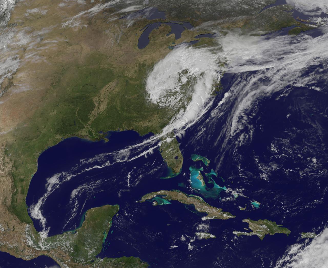 NASA image captured April 12, 2011 at 1731 UTC (1:31 p.m. EDT)  A giant swirl of clouds that form an apostrophe-like shape over the eastern U.S. was spotted in visible imagery from the Geostationary Operational Environmental Satellite, GOES-13 on April 12, 2011 at 1731 UTC (1:31 p.m. EDT).  The GOES-13 satellite monitors weather over the eastern continental U.S. and Atlantic Ocean, while GOES-11 monitors the western U.S. and the Eastern Pacific Ocean. GOES-13 captured this image of the clouds associated with a strong upper level low pressure area that is moving though the Tennessee River Valley and bringing moderate to heavy rainfall as it moves eastward. The low is forecast by the National Weather Service to bring unsettled conditions to the Mid-Atlantic and then to New England late Tuesday and Wednesday as it tracks northeast.  Severe thunderstorms are possible today in extreme eastern Virginia and North Carolina as the cold front associated with the low pushes through that region. Meanwhile, rainfall from the low stretches from Massachusetts south to Florida today.  It seems that New Englanders are having a tough time getting warm spring weather and this low won't help as it moves north. The low pressure area may even bring some light to moderate snowfall on the northern fringe of the storm.  The GOES series of satellites keep an eye on the weather happening over the continental U.S. and eastern Pacific and Atlantic Oceans. NASA's GOES Project, located at NASA's Goddard Space Flight Center in Greenbelt, Md., procures and manages the development and launch of the GOES series of satellites for NOAA and creates images and animations. The GOES satellites are operated by NOAA.  Rob Gutro NASA's Goddard Space Flight Center  <b><a href="http://goes.gsfc.nasa.gov/" rel="nofollow">Credit: NOAA/NASA GOES Project</a></b>  <b><a href="http://www.nasa.gov/centers/goddard/home/index.html" rel="nofollow">NASA Goddard Space Flight Center</a></b> enables NASA’s mission through four scientific endeavors: Earth Science, Heliophysics, Solar System Exploration, and Astrophysics. Goddard plays a leading role in NASA’s accomplishments by contributing compelling scientific knowledge to advance the Agency’s mission.  <b>Follow us on <a href="http://twitter.com/NASA_GoddardPix" rel="nofollow">Twitter</a></b>  <b>Join us on <a href="http://www.facebook.com/pages/Greenbelt-MD/NASA-Goddard/395013845897?ref=tsd" rel="nofollow">Facebook</a></b>