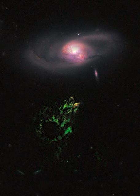 NASA image release January 10, 2011  In this image by NASA's Hubble Space Telescope, an unusual, ghostly green blob of gas appears to float near a normal-looking spiral galaxy.  The bizarre object, dubbed Hanny's Voorwerp (Hanny's Object in Dutch), is the only visible part of a 300,000-light-year-long streamer of gas stretching around the galaxy, called IC 2497. The greenish Voorwerp is visible because a searchlight beam of light from the galaxy's core illuminated it. This beam came from a quasar, a bright, energetic object that is powered by a black hole. The quasar may have turned off about 200,000 years ago.  This Hubble view uncovers a pocket of star clusters, the yellowish-orange area at the tip of Hanny's Voorwerp. The star clusters are confined to an area that is a few thousand light-years wide. The youngest stars are a couple of million years old. The Voorwerp is the size of our Milky Way galaxy, and its bright green color is from glowing oxygen.  Hubble also shows that gas flowing from IC 2497 may have instigated the star birth by compressing the gas in Hanny's Voorwerp. The galaxy is located about 650 million light-years from Earth.  What appears to be a gaping hole in Hanny's Voorwerp actually may be a shadow cast by an object in the quasar's light path. The feature gives the illusion of a hole about 20,000 light-years wide. Hubble reveals sharp edges but no other changes in the gas around the apparent opening, suggesting that an object close to the quasar may have blocked some of the light and projected a shadow on the Voorwerp. This phenomenon is similar to a fly on a movie projector lens casting a shadow on a movie screen.  An interaction between IC 2497 and another galaxy about a billion years ago may have created Hanny's Voorwerp and fueled the quasar. The Hubble image shows that IC 2497 has been disturbed, with complex dust patches, warped spiral arms, and regions of star formation around its core. These features suggest the aftermath of a galaxy merger. The bright spots in the central part of the galaxy are star-forming regions. The small, pinkish object to the lower right of IC 2497 is an edge-on spiral galaxy in the background.  The image was made by combining data from the Advanced Camera for Surveys (ACS) and the Wide Field Camera 3 (WFC3). The ACS exposures were taken April 12, 2010; the WFC3 data, April 4, 2010.  Object Names: Hanny's Voorwerp, IC 2497  Image Type: Astronomical  Credit: NASA, ESA, W. Keel (University of Alabama), and the Galaxy Zoo Team  <b><a href="http://www.nasa.gov/centers/goddard/home/index.html" rel="nofollow">NASA Goddard Space Flight Center</a></b> enables NASA’s mission through four scientific endeavors: Earth Science, Heliophysics, Solar System Exploration, and Astrophysics. Goddard plays a leading role in NASA’s accomplishments by contributing compelling scientific knowledge to advance the Agency’s mission.  <b>Follow us on <a href="http://twitter.com/NASA_GoddardPix" rel="nofollow">Twitter</a></b>  <b>Join us on <a href="http://www.facebook.com/pages/Greenbelt-MD/NASA-Goddard/395013845897?ref=tsd" rel="nofollow">Facebook</a></b>