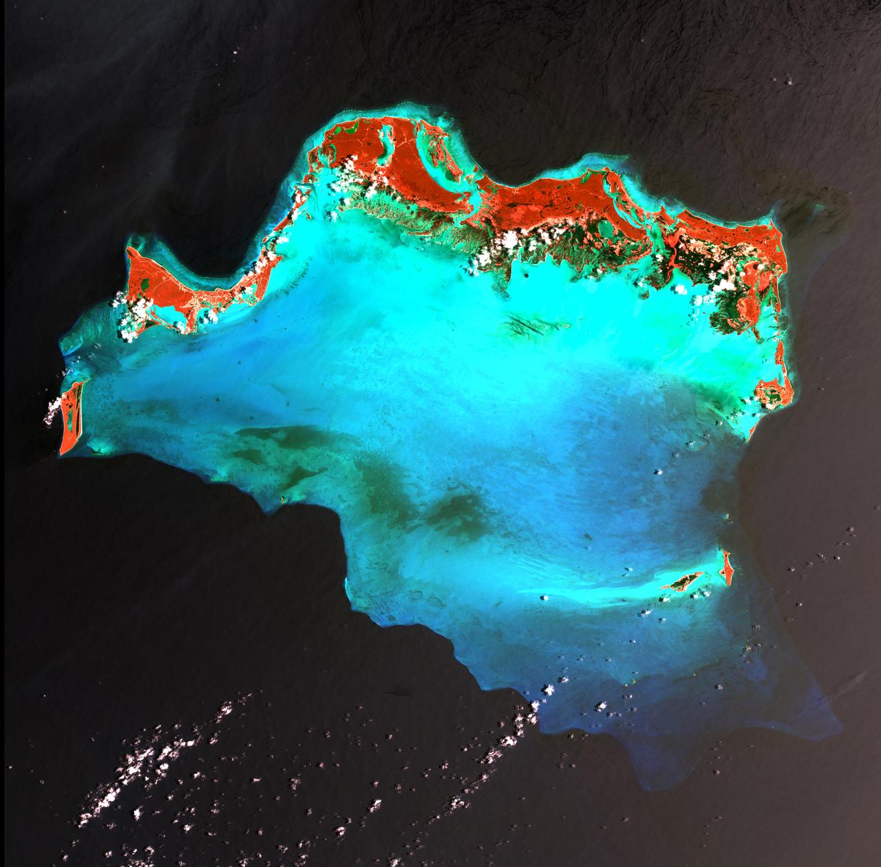 Caribbean Luxury - April 24th, 2003  Description: The Caicos Islands (pronounced KAY-kohss) in the northern Caribbean are a popular tourist attraction, renowned for their beautiful beaches, clear waters, scuba diving, and luxury resorts. The islands lie primarily along the northern perimeter of the submerged Caicos Bank (turquoise), a shallow limestone platform formed of sand, algae, and coral reefs covering 6,140 square kilometers (2,370 square miles).  Credit: USGS/NASA/Landsat 7  To learn more about the Landsat satellite go to: <a href="http://landsat.gsfc.nasa.gov/" rel="nofollow">landsat.gsfc.nasa.gov/</a>  <b><a href="http://www.nasa.gov/centers/goddard/home/index.html" rel="nofollow">NASA Goddard Space Flight Center</a></b> enables NASA’s mission through four scientific endeavors: Earth Science, Heliophysics, Solar System Exploration, and Astrophysics. Goddard plays a leading role in NASA’s accomplishments by contributing compelling scientific knowledge to advance the Agency’s mission.  <b>Follow us on <a href="http://twitter.com/NASA_GoddardPix" rel="nofollow">Twitter</a></b>  <b>Join us on <a href="http://www.facebook.com/pages/Greenbelt-MD/NASA-Goddard/395013845897?ref=tsd" rel="nofollow">Facebook</a></b>