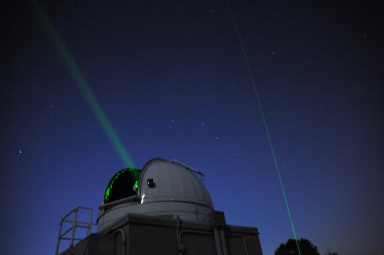 Double beams shoot into the night sky during the Internation Observe the Moon night event.   Goddard's Laser Ranging Facility directs a laser toward the Lunar Reconassaince Orbiter on International Observe the Moon Night. (Sept 18, 2010)  Background on laser ranging: <a href="http://www.nasa.gov/mission_pages/LRO/news/LRO_lr.html" rel="nofollow">www.nasa.gov/mission_pages/LRO/news/LRO_lr.html</a>  Credit: NASA/GSFC/Debbie Mccallum  On September 18, 2010 the world joined the NASA Goddard Space Flight Center's Visitor Center in Greenbelt, Md., as well as other NASA Centers to celebrate the first annual International Observe the Moon Night (InOMN).  To read more go to: <a href="http://www.nasa.gov/centers/goddard/news/features/2010/moon-night.html" rel="nofollow">www.nasa.gov/centers/goddard/news/features/2010/moon-nigh...</a>  <b><a href="http://www.nasa.gov/centers/goddard/home/index.html" rel="nofollow">NASA Goddard Space Flight Center</a></b>  contributes to NASA’s mission through four scientific endeavors: Earth Science, Heliophysics, Solar System Exploration, and Astrophysics. Goddard plays a leading role in NASA’s endeavors by providing compelling scientific knowledge to advance the Agency’s mission.  <b>Follow us on <a href="http://twitter.com/NASA_GoddardPix" rel="nofollow">Twitter</a></b>  <b>Join us on <a href="http://www.facebook.com/pages/Greenbelt-MD/NASA-Goddard/395013845897?ref=tsd" rel="nofollow">Facebook</a></b>