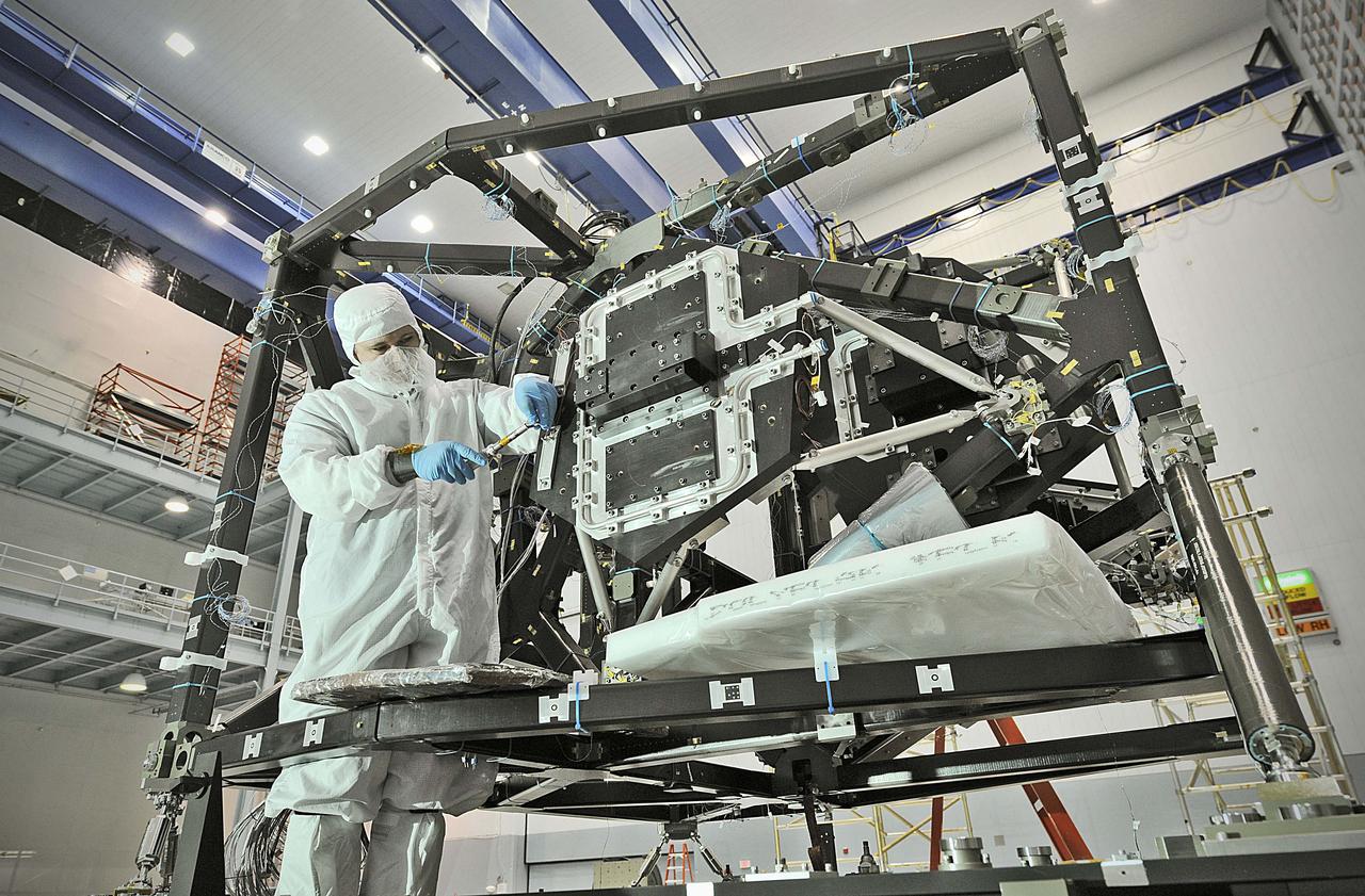 NASA image release September 17, 2010  In preparation for a cryogenic test NASA Goddard technicians install instrument mass simulators onto the James Webb Space Telescope ISIM structure.  The ISIM Structure supports and holds the four Webb telescope science instruments : the Mid-Infrared Instrument (MIRI), the Near-Infrared Camera (NIRCam), the Near-Infrared Spectrograph (NIRSpec) and the Fine Guidance Sensor (FGS).   Credit: NASA/GSFC/Chris Gunn  To learn more about the James Webb Space Telescope go to: <a href="http://www.jwst.nasa.gov/" rel="nofollow">www.jwst.nasa.gov/</a>  <b><a href="http://www.nasa.gov/centers/goddard/home/index.html" rel="nofollow">NASA Goddard Space Flight Center</a></b>  contributes to NASA’s mission through four scientific endeavors: Earth Science, Heliophysics, Solar System Exploration, and Astrophysics. Goddard plays a leading role in NASA’s endeavors by providing compelling scientific knowledge to advance the Agency’s mission.  <b>Follow us on <a href="http://twitter.com/NASA_GoddardPix" rel="nofollow">Twitter</a></b>  <b>Join us on <a href="http://www.facebook.com/pages/Greenbelt-MD/NASA-Goddard/395013845897?ref=tsd" rel="nofollow">Facebook</a></b>