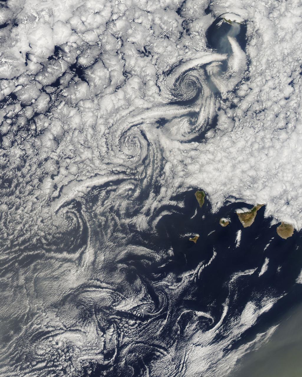NASA image acquired August 14, 2010 at 14:55 UTC  Cloud vortices off Madeira and Canary Islands  Satellite: Aqua  Credit: NASA/GSFC/Jeff Schmaltz/MODIS Land Rapid Response Team  Click here to see more images from <b><a href="http://rapidfire.sci.gsfc.nasa.gov/gallery/?latest" rel="nofollow">MODIS</a></b>  <b><a href="http://www.nasa.gov/centers/goddard/home/index.html" rel="nofollow">NASA Goddard Space Flight Center</a></b>  is home to the nation's largest organization of combined scientists, engineers and technologists that build spacecraft, instruments and new technology to study the Earth, the sun, our solar system, and the universe.  <b>Follow us on <a href="http://twitter.com/NASA_GoddardPix" rel="nofollow">Twitter</a></b>  <b>Join us on <a href="http://www.facebook.com/pages/Greenbelt-MD/NASA-Goddard/395013845897?ref=tsd" rel="nofollow">Facebook</a><b></b></b>