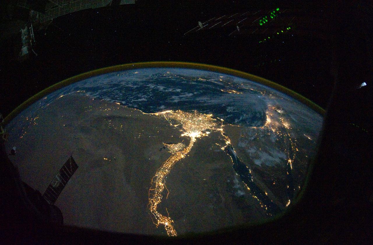From 220 miles above Earth, one of the Expedition 25 crew members on the International Space Station took this night time photo featuring the bright lights of Cairo and Alexandria, Egypt on the Mediterranean coast. The Nile River and its delta stand out clearly as well. On the horizon, the airglow of the atmosphere is seen across the Mediterranean. The Sinai Peninsula, at right, is outlined with lights highlighting the Gulf of Suez and Gulf of Aqaba.   Credit: NASA
