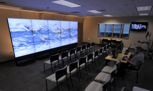 The NASA Center for Climate Simulation (NCCS) Data Exploration Theater features a 17- by 6-foot multi-screen visualization wall for engaging visitors and scientists with high-definition movies of simulation results. Here, the wall displays a 5-kilometer-resolution global simulation that captures numerous cloud types at groundbreaking fidelity.   Credit: NASA/Pat Izzo  To learn more about NCCS go to: <a href="http://www.nasa.gov/topics/earth/features/climate-sim-center.html" rel="nofollow">www.nasa.gov/topics/earth/features/climate-sim-center.html</a>  NASA Goddard Space Flight Center  is home to the nation's largest organization of combined scientists, engineers and technologists that build spacecraft, instruments and new technology to study the Earth, the sun, our solar system, and the universe.