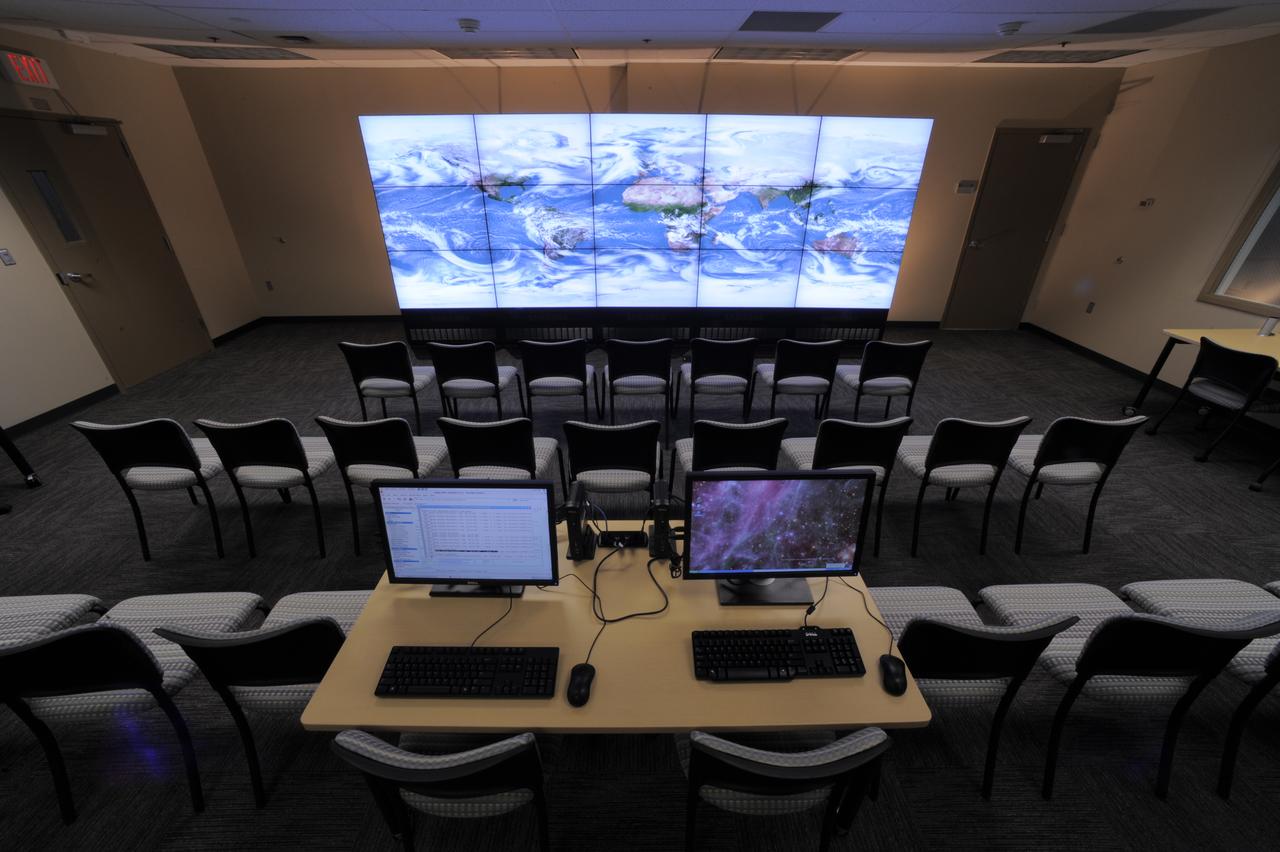 The NASA Center for Climate Simulation (NCCS) Data Exploration Theater features a 17- by 6-foot multi-screen visualization wall for engaging visitors and scientists with high-definition movies of simulation results. Here, the wall displays a 5-kilometer-resolution global simulation that captures numerous cloud types at groundbreaking fidelity.   Credit: NASA/Pat Izzo  To learn more about NCCS go to: <a href="http://www.nasa.gov/topics/earth/features/climate-sim-center.html" rel="nofollow">www.nasa.gov/topics/earth/features/climate-sim-center.html</a>  NASA Goddard Space Flight Center  is home to the nation's largest organization of combined scientists, engineers and technologists that build spacecraft, instruments and new technology to study the Earth, the sun, our solar system, and the universe.