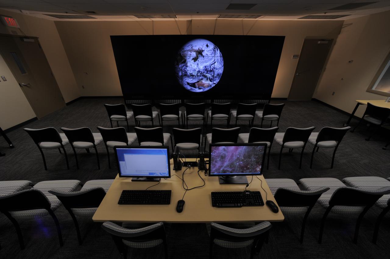 The NASA Center for Climate Simulation (NCCS) Data Exploration Theater features a 17- by 6-foot multi-screen visualization wall for engaging visitors and scientists with high-definition movies of simulation results. Here, the wall displays a 3.5-kilometer-resolution global simulation that captures numerous cloud types at groundbreaking fidelity.   Credit: NASA/Pat Izzo  To learn more about NCCS go to: <a href="http://www.nasa.gov/topics/earth/features/climate-sim-center.html" rel="nofollow">www.nasa.gov/topics/earth/features/climate-sim-center.html</a>  NASA Goddard Space Flight Center  is home to the nation's largest organization of combined scientists, engineers and technologists that build spacecraft, instruments and new technology to study the Earth, the sun, our solar system, and the universe.