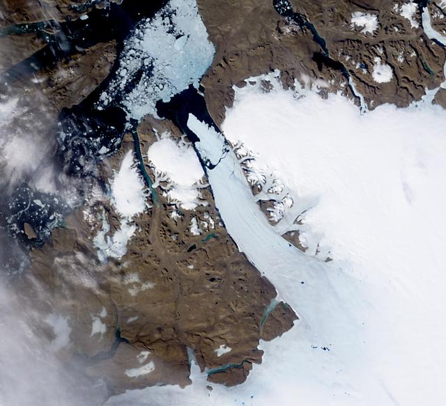 NASA image acquired August 5, 2010  On August 5, 2010, an enormous chunk of ice, roughly 97 square miles (251 square kilometers) in size, broke off the Petermann Glacier, along the northwestern coast of Greenland. The Canadian Ice Service detected the remote event within hours in near real-time data from the Moderate Resolution Imaging Spectroradiometer (MODIS) on NASA’s Aqua satellite. The Peterman Glacier lost about one-quarter of its 70-kilometer (40-mile) long floating ice shelf, said researchers who analyzed the satellite data at the University of Delaware.  The Moderate Resolution Imaging Spectroradiometer (MODIS) on NASA’s Terra satellite captured these natural-color images of Petermann Glacier 18:05 UTC on August 5, 2010 (top), and 17:15 UTC on July 28, 2010 (bottom). The Terra image of the Petermann Glacier on August 5 was acquired almost 10 hours after the Aqua observation that first recorded the event. By the time Terra took this image, skies were less cloudy than they had been earlier in the day, and the oblong iceberg had broken free of the glacier and moved a short distance down the fjord.  Icebergs calving off the Petermann Glacier are not unusual. Petermann Glacier’s floating ice tongue is the Northern Hemisphere’s largest, and it has occasionally calved large icebergs. The recently calved iceberg is the largest to form in the Arctic since 1962, said the University of Delaware.  To read more and or to download the high res go here: <a href="http://www.nasa.gov/topics/earth/features/petermann-calve.html" rel="nofollow">www.nasa.gov/topics/earth/features/petermann-calve.html</a>  or  Click here to see more images from <b><a href="#//earthobservatory.nasa.gov/" rel="nofollow"> NASA Goddard’s Earth Observatory</a></b>  NASA Earth Observatory image created by Jesse Allen and Robert Simmon, using data obtained from the Goddard Level 1 and Atmospheric Archive and Distribution System (LAADS). Caption by Holli Riebeek and Michon Scott.  Instrument: Terra - MODIS  <b><a href="http://www.nasa.gov/centers/goddard/home/index.html" rel="nofollow">NASA Goddard Space Flight Center</a></b>  is home to the nation's largest organization of combined scientists, engineers and technologists that build spacecraft, instruments and new technology to study the Earth, the sun, our solar system, and the universe.  <b>Follow us on <a href="http://twitter.com/NASA_GoddardPix" rel="nofollow">Twitter</a></b>  <b>Join us on <a href="http://www.facebook.com/pages/Greenbelt-MD/NASA-Goddard/395013845897?ref=tsd" rel="nofollow">Facebook</a><b></b></b>