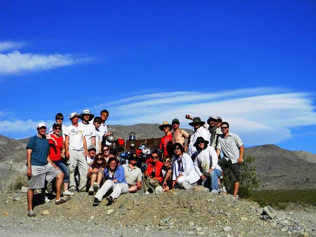 This group photo of the LPSA interns and trip leaders was taken at Tea Kettle Junction in Death Valley, Calif. (Standing on left side, left to right): Kristopher Schwebler, Valerie Fox, Emily Kopp, Kyle Yawn, Dan Burger, Ian Schoch, Devon Miller; (left to right, sitting) Justin Wilde, Jessica Marbourg, Maggie McAdam (a trip leader), Leva McIntire, Ann Parsons (a trip leader), Mindy Krzykowski, Emma McKinney, Cynthia Cheung (LPSA principal investigator and a trip leader), George Fercana; (standing on right side): Kynan Rilee, Gregory Romine, Clint Naquin, Gunther Kletetschka (a trip leader), Andrew Ryan, and in the very back, Brian Jackson (a trip leader).  Photo credit: NASA/GSFC/ Leva McIntire/LPSA intern  To read a feature story on the Racetrack Playa go to: <a href="http://www.nasa.gov/topics/earth/features/roving-rocks.html" rel="nofollow">www.nasa.gov/topics/earth/features/roving-rocks.html</a>   <b><a href="http://www.nasa.gov/centers/goddard/home/index.html" rel="nofollow">NASA Goddard Space Flight Center</a></b>  is home to the nation's largest organization of combined scientists, engineers and technologists that build spacecraft, instruments and new technology to study the Earth, the sun, our solar system, and the universe.  <b>Follow us on <a href="http://twitter.com/NASA_GoddardPix" rel="nofollow">Twitter</a></b>  <b>Join us on <a href="http://www.facebook.com/pages/Greenbelt-MD/NASA-Goddard/395013845897?ref=tsd" rel="nofollow">Facebook</a><b></b></b>