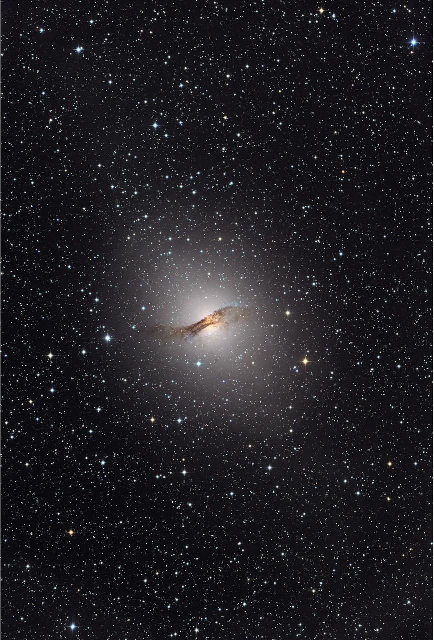 NASA release April 1, 2010  The giant elliptical galaxy NGC 5128, show here in visible light, hosts the radio source known as Centaurus A. Located 12 million light-years away, it is one of the closest active galaxies.   Credit: Capella Observatory  To learn more about these images go to: <a href="http://www.nasa.gov/mission_pages/GLAST/news/smokestack-plumes.html" rel="nofollow">www.nasa.gov/mission_pages/GLAST/news/smokestack-plumes.html</a>  <b><a href="http://www.nasa.gov/centers/goddard/home/index.html" rel="nofollow">NASA Goddard Space Flight Center</a></b>  is home to the nation's largest organization of combined scientists, engineers and technologists that build spacecraft, instruments and new technology to study the Earth, the sun, our solar system, and the universe.