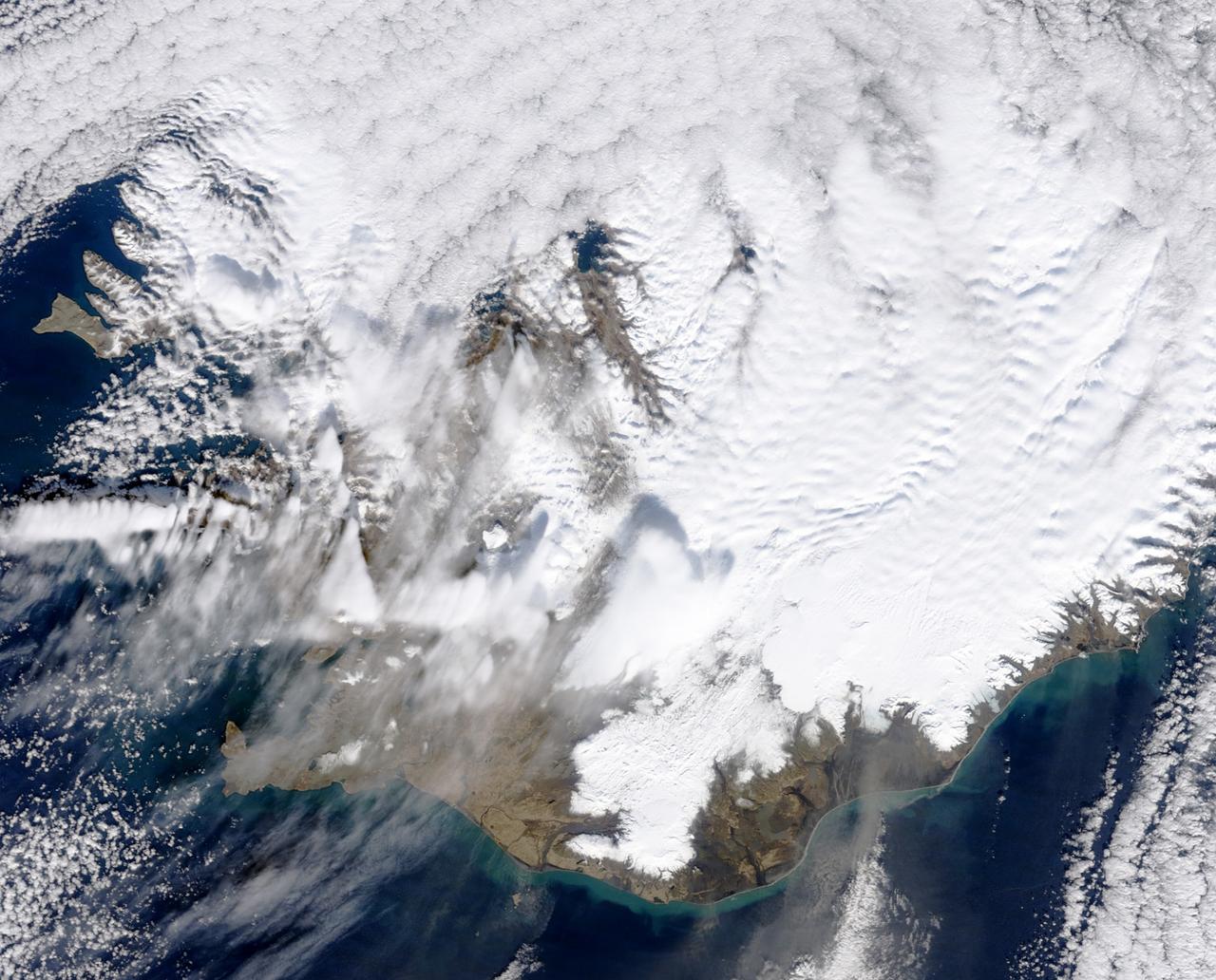 March 31, 2010..The volcanic eruption near Eyjafjallajökull persists into its second week, with continued lava fountaining and lava flows spilling into nearby canyons. The eruption is located at the Fimmvörduháls Pass between the Eyjafjallajökull ice field to the west (left) and the Mýrdalsjökull ice field to the east (right).  This natural-color satellite image was acquired on March 26, 2010, by the MODIS aboard NASA’s Terra satellite. Dark ash and scoria cover the northern half of the Fimmvörduháls Pass. White snow covers the rest of the pass, sandwiched between white glaciers. Snow-free land is tan, brown, or dark gray, devoid of vegetation in early spring.  To download a high res version of this image go to:  <a href="http://modis.gsfc.nasa.gov/gallery/individual.php?db_date=2010-03-31" rel="nofollow">modis.gsfc.nasa.gov/gallery/individual.php?db_date=2010-0...</a>  <b><a href="http://www.nasa.gov/centers/goddard/home/index.html" rel="nofollow">NASA Goddard Space Flight Center</a></b>  is home to the nation's largest organization of combined scientists, engineers and technologists that build spacecraft, instruments and new technology to study the Earth, the sun, our solar system, and the universe.
