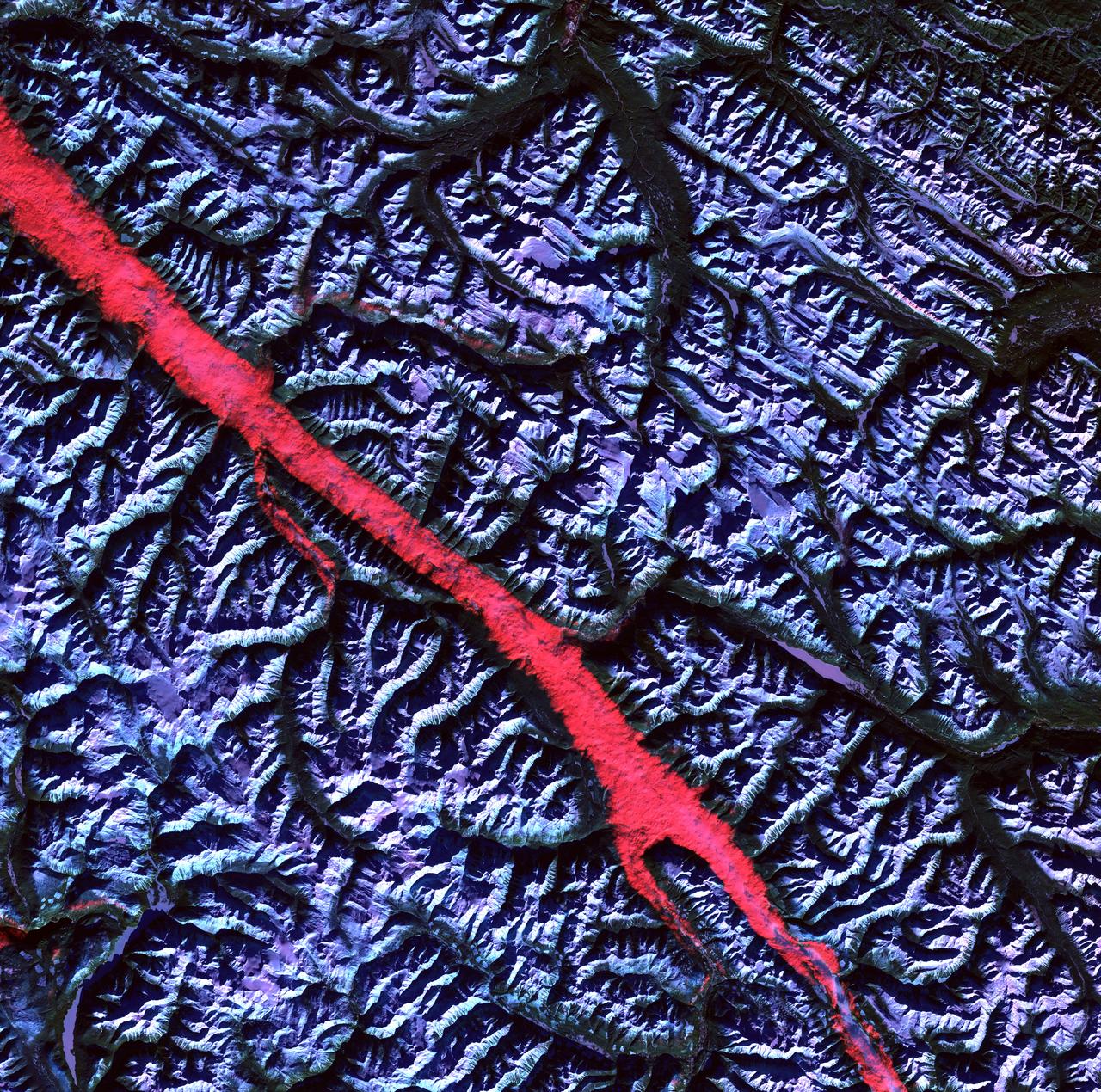 Acquisition Date: February 2004 The high reflectance of clouds compared to the surrounding land, coupled with the low sun elevation when this image was acquired, causes low clouds to appear red as they fill a portion of the Rocky Mountain Trench. Running parallel with the peaks of the Canadian Rockies and ranging from 2 to 10 miles (3 to 16 kilometers) wide and about 900 miles (1,448 kilometers) long, the Trench aligns with the Fraser River and makes its way past Mount Robson, the highest peak in the Canadian Rockies at 12,972 feet (3,954 meters). Mount Robson is near the center of this image. Credit: NASA/GSFC/Landsat/USGS To learn more about Landsat and to see the orginal high res file go to: <a href="http://landsat.usgs.gov/gallery_view.php?category=greenflag&thesort=mainTitle" rel="nofollow">landsat.usgs.gov/gallery_view.php?category=greenflag&...</a>
