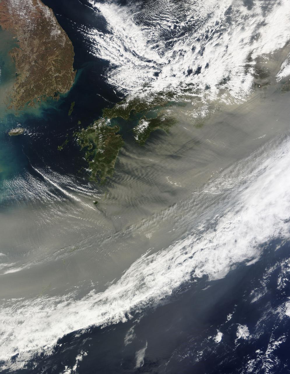 March 24, 2010 - Dust over Japan  This image of gray/brown dust being blown over Japan was captured on March 21, 2010 by the MODIS on the Terra satellite. On the left is the Korean peninsula. Japan stretches diagonally across the image, up to the top right corner.  The dust is likely from the sandstorm that swept across the China the previous day. The sand and dust originated from the south and east of Inner Mongolia. In this image from March 20, the dust is nearly obscuring the Bohai Sea, which is just west of the Korean peninsula. Here is a handy map.   For more information related to this image go to:  <a href="http://modis.gsfc.nasa.gov/gallery/individual.php?db_date=2010-03-24" rel="nofollow">modis.gsfc.nasa.gov/gallery/individual.php?db_date=2010-0...</a>   For more information about Goddard Space Flight Center go here:  <a href="http://www.nasa.gov/centers/goddard/home/index.html" rel="nofollow">www.nasa.gov/centers/goddard/home/index.html</a>