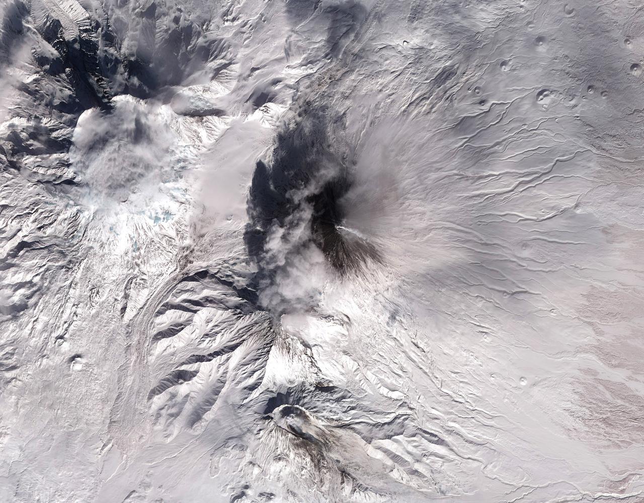 Shiveluch volcano on Russia’s Kamchatka Peninsula. This is a false-color satellite image, acquired by the Advanced Spaceborne Thermal Emission and Reflection Radiometer (ASTER) on March 10, 2010.  To download a full high res version of this image and to learn more go to:  <a href="http://earthobservatory.nasa.gov/NaturalHazards/view.php?id=43103" rel="nofollow">earthobservatory.nasa.gov/NaturalHazards/view.php?id=43103</a>  Credit: NASA Earth Observatory image by Jesse Allen and Robert Simmon, based on data from the NASA/GSFC/METI/ERSDAC/JAROS, and U.S./Japan ASTER Science Team.  Instrument:  Terra - ASTER  For more information about the Goddard Space Flight Center go here:  <a href="http://www.nasa.gov/centers/goddard/home/index.html" rel="nofollow">www.nasa.gov/centers/goddard/home/index.html</a>