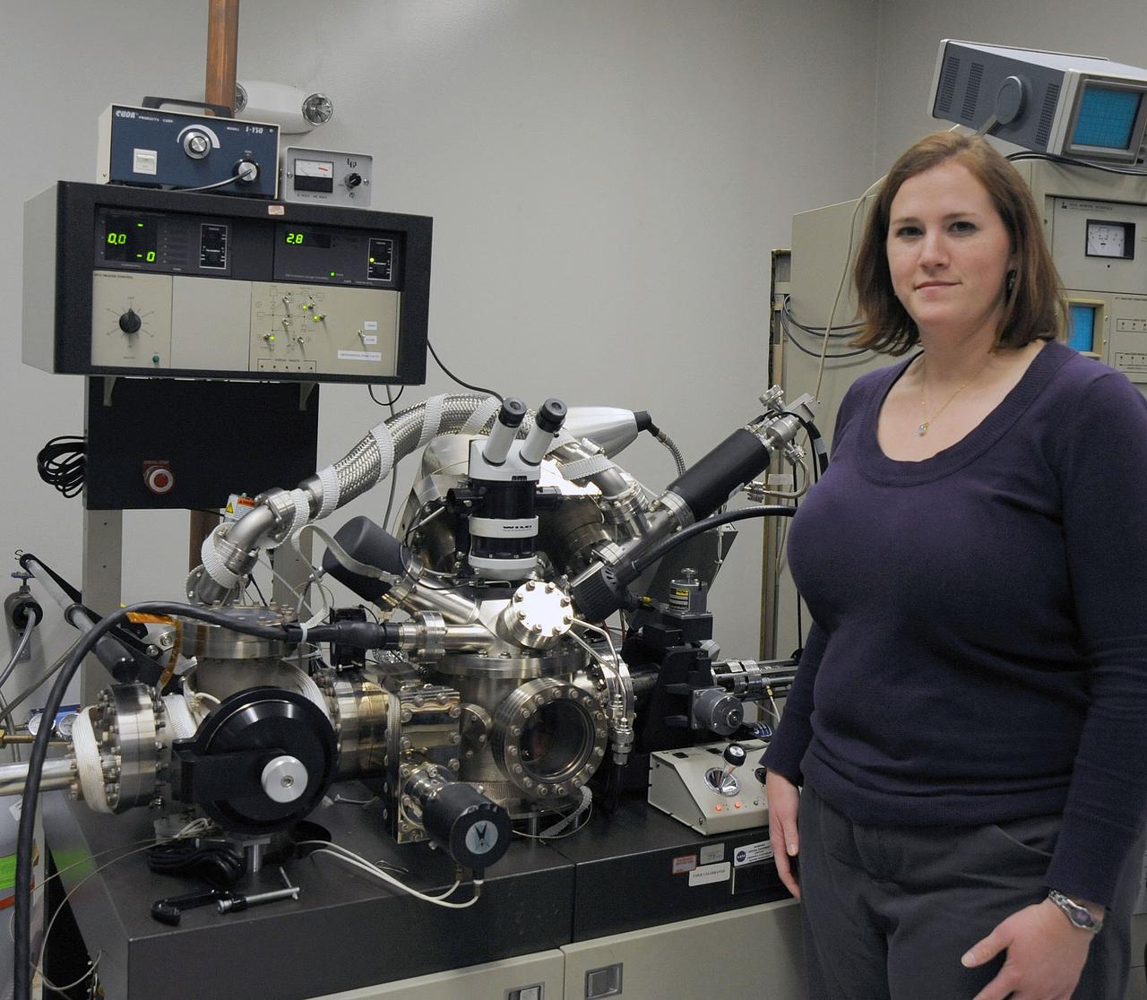 Marjorie Sovinski looking for the presence of chromium, which would help confirm that the exterior of the film had a chromium conversion coating.  PHOTO CREDIT: NASA/Debbie Mccallum