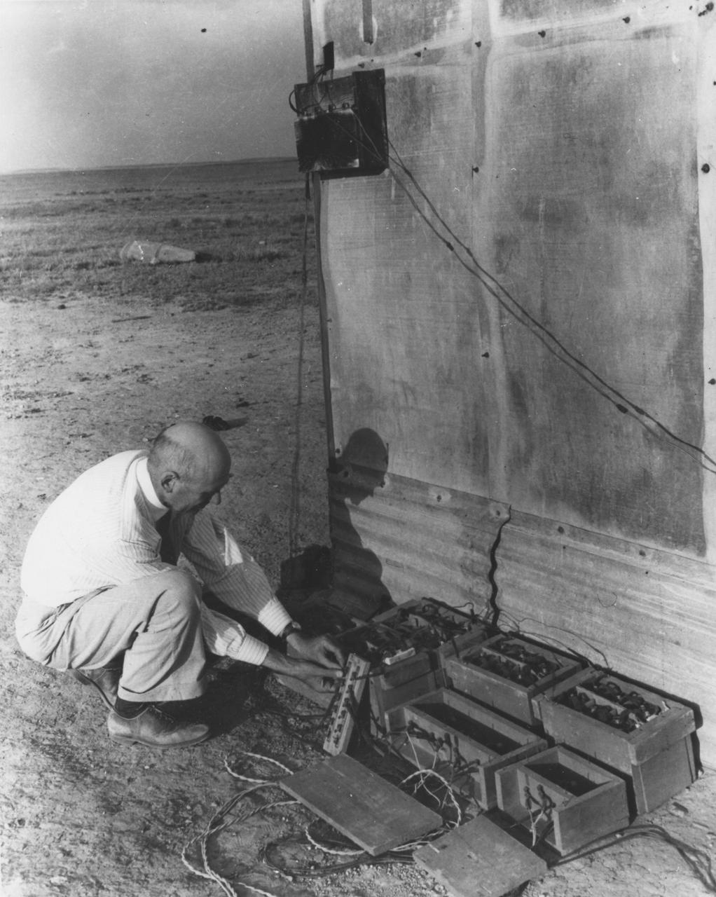 Dr. Robert Goddard with batteries and relay at the launch tower, May 19, 1937. <b><a href="http://www.nasa.gov/centers/goddard/home/index.html" rel="nofollow">NASA Goddard Space Flight Center</a></b> enables NASA’s mission through four scientific endeavors: Earth Science, Heliophysics, Solar System Exploration, and Astrophysics. Goddard plays a leading role in NASA’s accomplishments by contributing compelling scientific knowledge to advance the Agency’s mission. <b>Follow us on <a href="http://twitter.com/NASA_GoddardPix" rel="nofollow">Twitter</a></b> <b>Join us on <a href="http://www.facebook.com/pages/Greenbelt-MD/NASA-Goddard/395013845897?ref=tsd" rel="nofollow">Facebook</a></b>