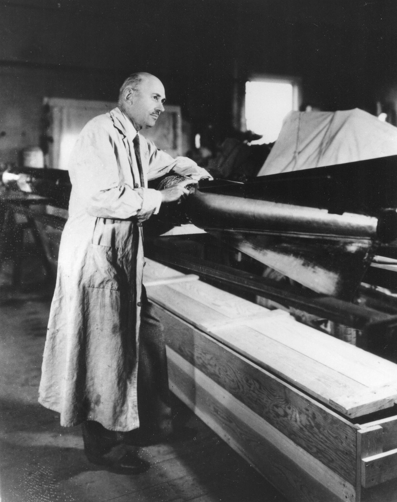 Robert Goddard works with a rocket in his workshop in 1935