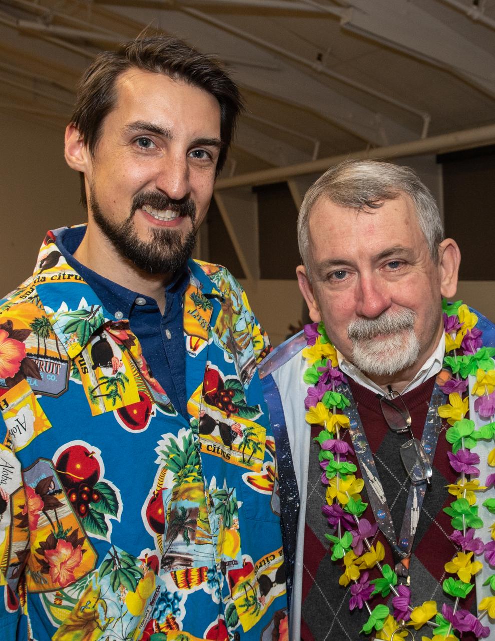 Rob Garner (left) and then-Goddard News Chief Ed Campion celebrating the latter's retirement in 2018. Aloha shirt Fridays were a mainstay of Campion's tenure.