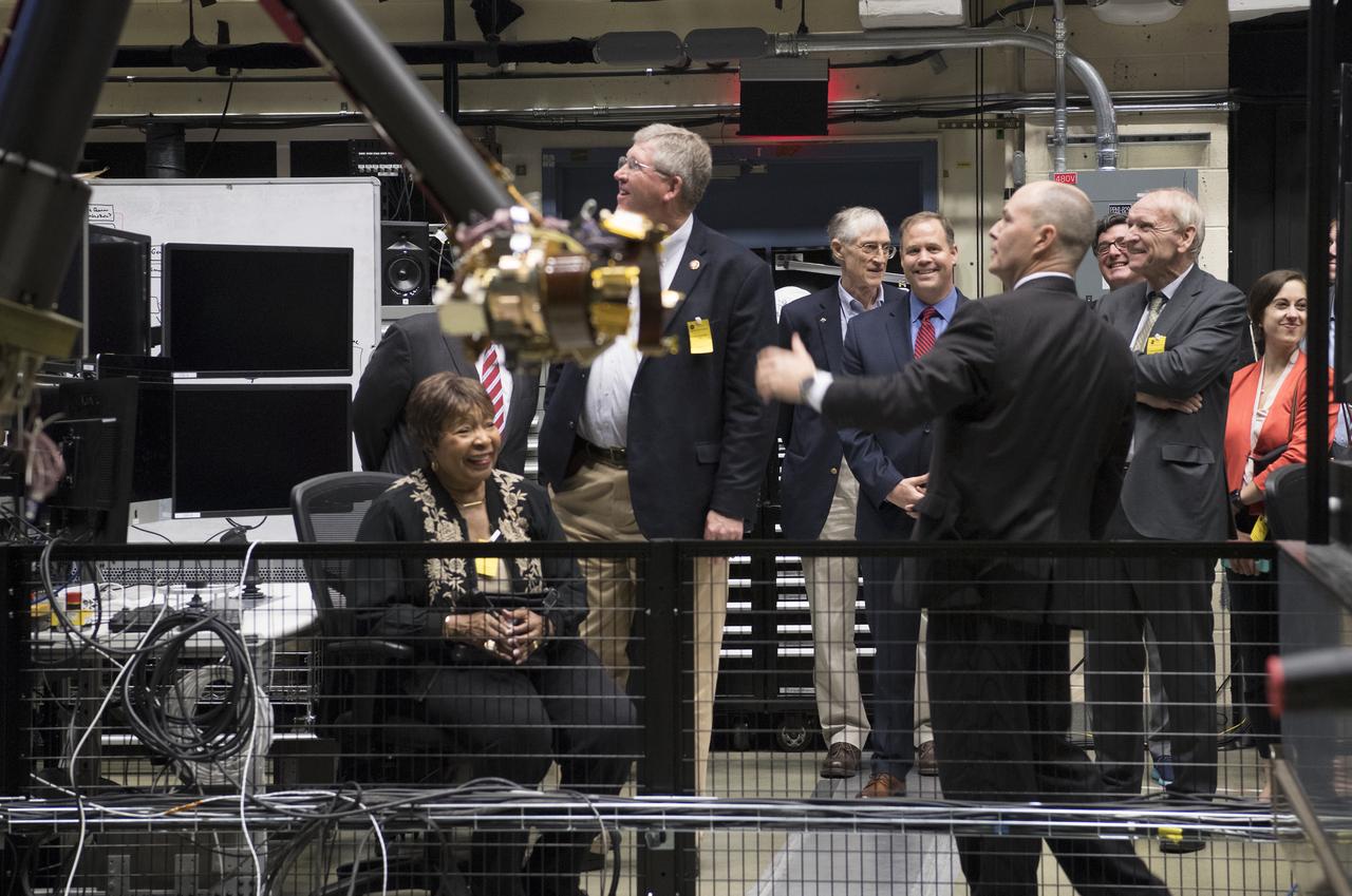 Jim Bridenstine and congressional staff visited Goddard on May 6, 2019.  Here Ben Reed explains robotic arm in Satellite Servicing facility.  