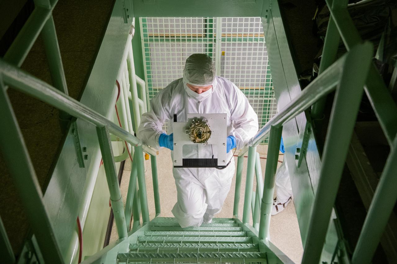 Manufacturing Engineer, Roman Nilov transports the Ocean Color Instrument flight Collimator Slit Assembly for inspection in the cleanroom at Goddard Space Flight Center in Greenbelt, MD on July 6th, 2021.  Photographer: Denny Henry – Goddard Space Flight Center