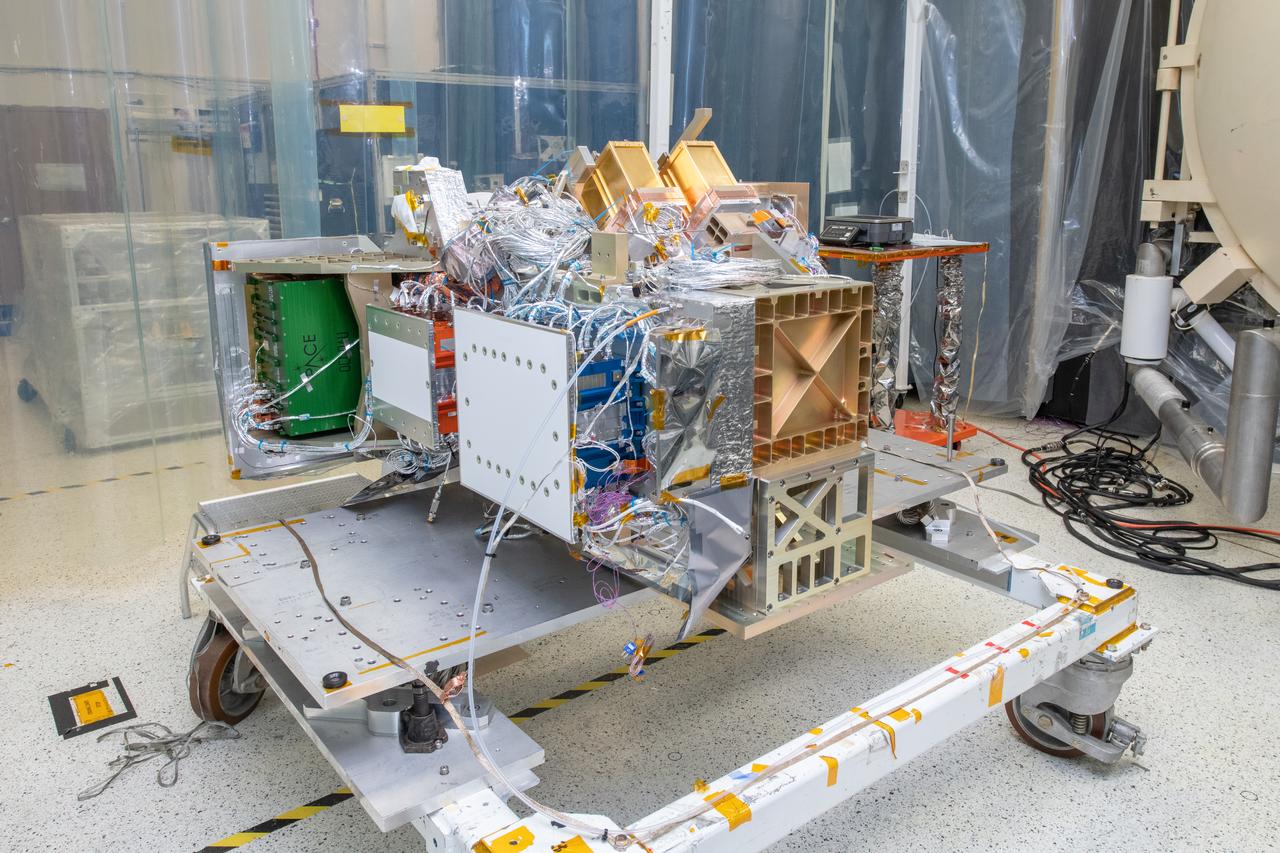 The Ocean Color Instrument (OCI) is installed on its transportation dolly and prepared for additional integration operations in a clean tent.  OCI is a highly advanced optical spectrometer that will be used to measure properties of light over portions of the electromagnetic spectrum. It will enable continuous measurement of light at finer wavelength resolution than previous NASA satellite sensors, extending key system ocean color data records for climate studies. OCI is PACE's (Plankton, Aerosol, Cloud, ocean Ecosystem) primary sensor built at Goddard Space Flight Center in Greenbelt, MD.
