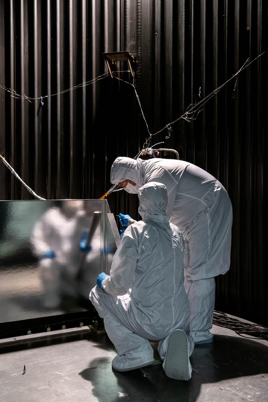 Mechanical Technicians, Daniel Dizon and Joseph Eddy, install the Ocean Color Instrument (OCI) Earth Shade into a thermal vacuum chamber so that team members can test the thermal capabilities of the hardware under a simulated space environment.  OCI is a highly advanced optical spectrometer that will be used to measure properties of light over portions of the electromagnetic spectrum. It will enable continuous measurement of light at finer wavelength resolution than previous NASA satellite sensors, extending key system ocean color data records for climate studies. OCI is PACE's (Plankton, Aerosol, Cloud, ocean Ecosystem) primary sensor built at Goddard Space Flight Center in Greenbelt, MD.