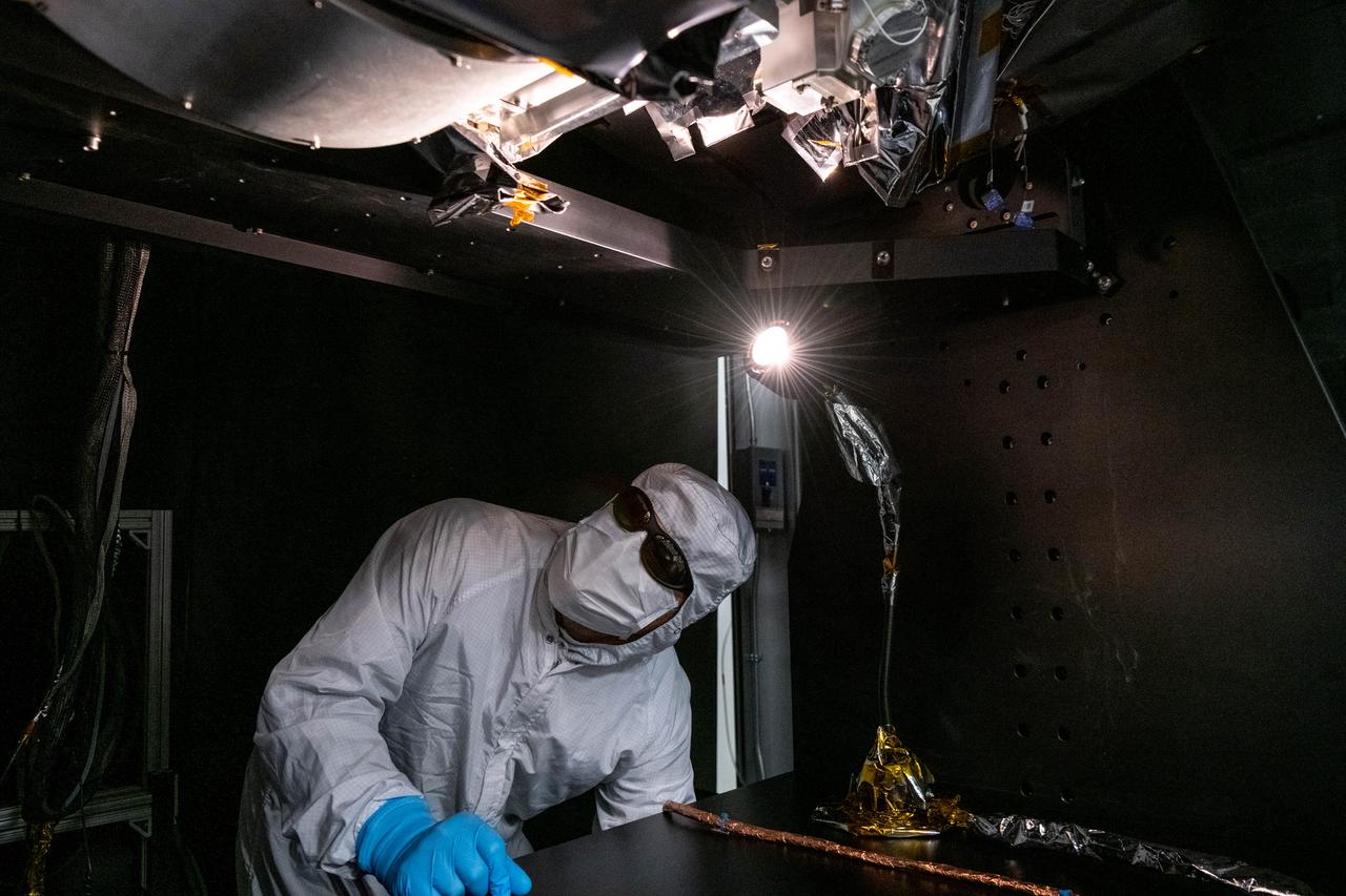 Manufacturing engineer, Roman Nilov, inspects flight hardware after technicians install the Short Wave Infrared (SWIR) Pulse Calibration Assembly (SPCA) fold mirror assembly to the Ocean Color Instrument (OCI).   OCI is a highly advanced optical spectrometer that will be used to measure properties of light over portions of the electromagnetic spectrum. It will enable continuous measurement of light at finer wavelength resolution than previous NASA satellite sensors, extending key system ocean color data records for climate studies. OCI is PACE's (Plankton, Aerosol, Cloud, ocean Ecosystem) primary sensor built at Goddard Space Flight Center in Greenbelt, MD.