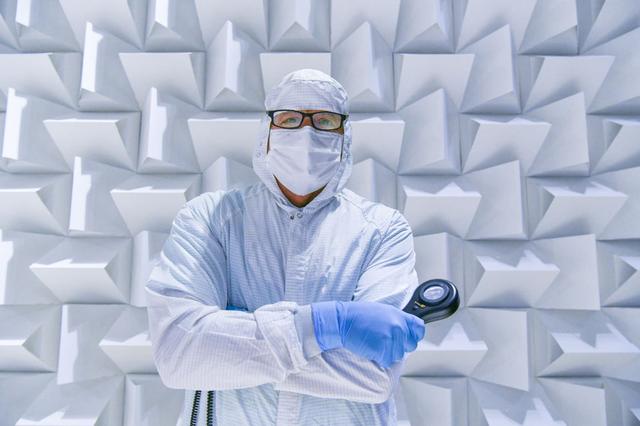 Quality engineer, John Tota, poses with a magnifying glass and stands close to the textured wall in the Electro Magnetic Interference (EMI) chamber. Mr. Tota works to ensure the overall quality of the flight hardware builds on the Ocean Color Instrument (OCI).   OCI is a highly advanced optical spectrometer that will be used to measure properties of light over portions of the electromagnetic spectrum. It will enable continuous measurement of light at finer wavelength resolution than previous NASA satellite sensors, extending key system ocean color data records for climate studies. OCI is PACE's (Plankton, Aerosol, Cloud, ocean Ecosystem) primary sensor built at Goddard Space Flight Center in Greenbelt, MD.