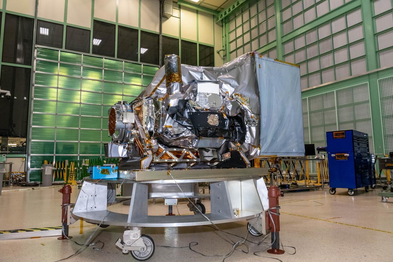 The Ocean Color Instrument (OCI) is integrated on the Tilt Mechanism prior to environmental testing in the Spacecraft Checkout Area (SCA) cleanroom. The OCI Tilt will help the instrument avoid sun glint in a space environment.  OCI is a highly advanced optical spectrometer that will be used to measure properties of light over portions of the electromagnetic spectrum. It will enable continuous measurement of light at finer wavelength resolution than previous NASA satellite sensors, extending key system ocean color data records for climate studies. OCI is PACE's (Plankton, Aerosol, Cloud, ocean Ecosystem) primary sensor built at Goddard Space Flight Center in Greenbelt, MD.