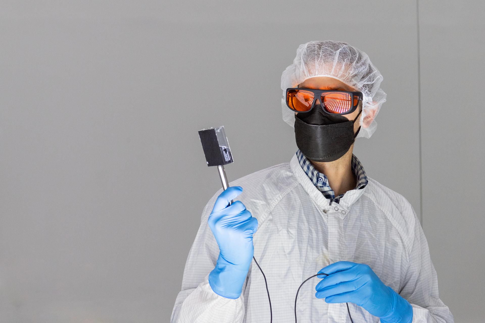 Tucker Ryan Thomas with G2V takes calibration readings from the OSAM-1 solar simulators during their commissioning tests inside a cleanroom at Goddard Space Flight Center, Greenbelt Md., Oct 3, 2022. This photo has been cleared for public release. NASA/Mike Guinto