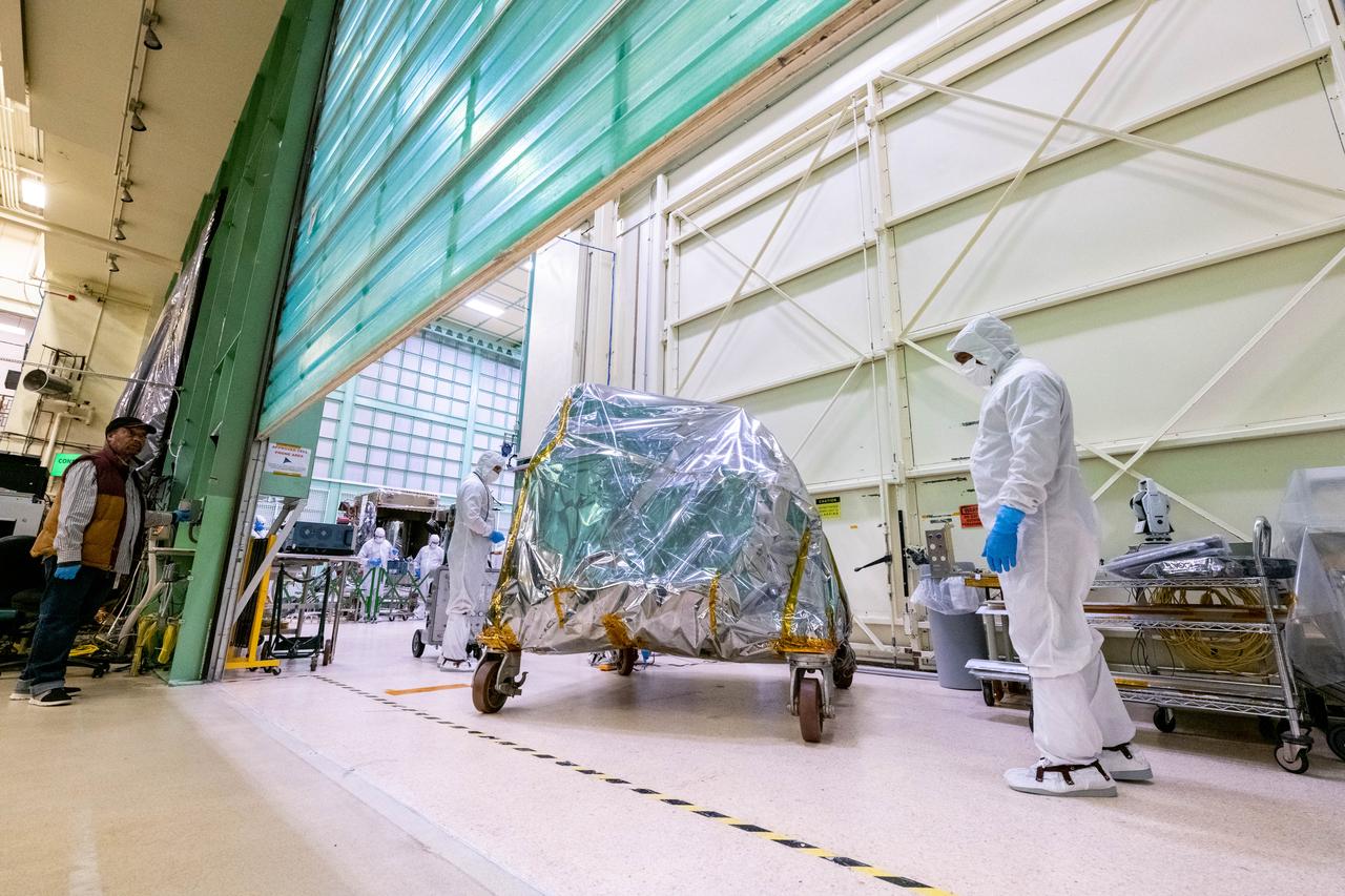 The Ocean Color Instrument (OCI) team transports the instrument on its dolly to a cleanroom at Goddard Space Flight Center for final operations prior to integration to the Plankton, Aerosol, Cloud, ocean Ecosystem (PACE) spacecraft. OCI is a highly advanced optical spectrometer that will be used to measure properties of light over portions of the electromagnetic spectrum. It will enable continuous measurement of light at finer wavelength resolution than previous NASA satellite sensors, extending key system ocean color data records for climate studies. OCI is PACE's primary sensor built at Goddard Space Flight Center in Greenbelt, MD.