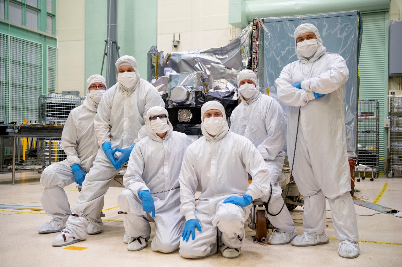 The Ocean Color Instrument (OCI) mechanical technician team pose in front of the instrument after successfully installing the earth shade. OCI is a highly advanced optical spectrometer that will be used to measure properties of light over portions of the electromagnetic spectrum. It will enable continuous measurement of light at finer wavelength resolution than previous NASA satellite sensors, extending key system ocean color data records for climate studies. OCI is PACE's (Plankton, Aerosol, Cloud, ocean Ecosystem) primary sensor built at Goddard Space Flight Center in Greenbelt, MD.