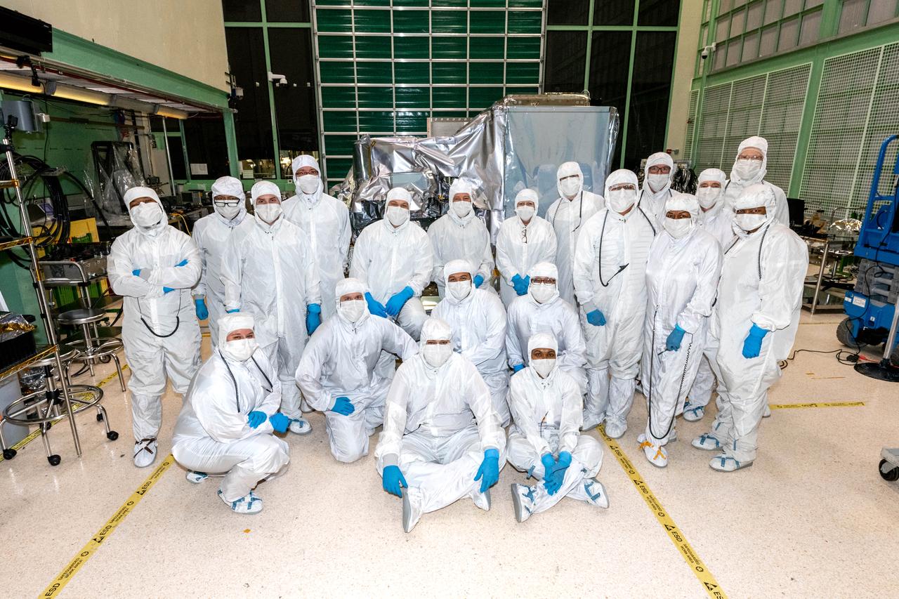 Ocean Color Instrument (OCI) team members pose with the flight hardware after successful instrument integration to the Tilt mechanism. OCI is a highly advanced optical spectrometer that will be used to measure properties of light over portions of the electromagnetic spectrum. It will enable continuous measurement of light at finer wavelength resolution than previous NASA satellite sensors, extending key system ocean color data records for climate studies. OCI is PACE's (Plankton, Aerosol, Cloud, ocean Ecosystem) primary sensor built at Goddard Space Flight Center in Greenbelt, MD.