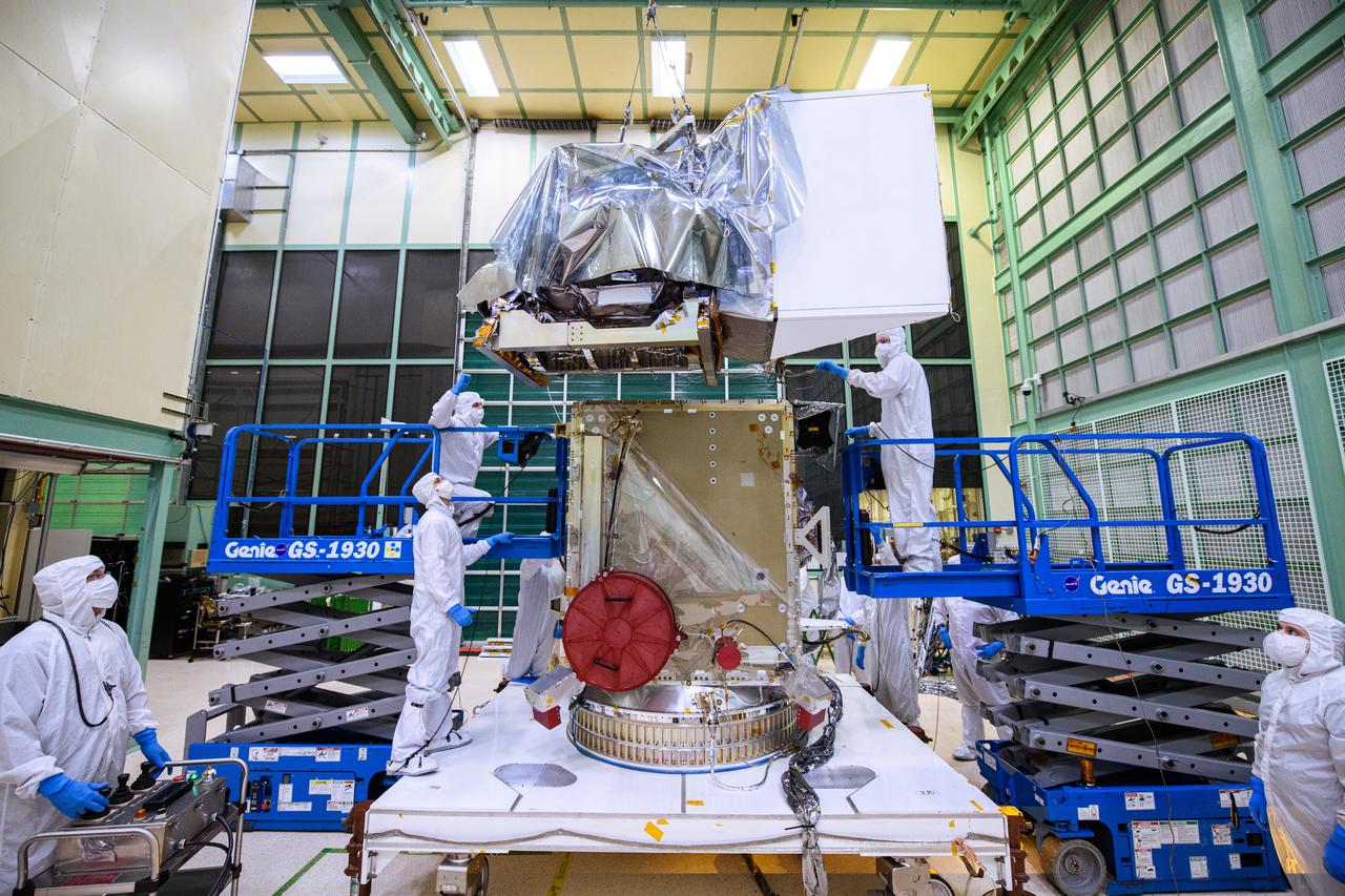Mechanical technicians install the Flight Ocean Color Instrument (OCI) and Tilt Platform Assembly to the Plankton, Aerosol, Cloud, ocean Ecosystem (PACE) spacecraft. By installing the instrument, the spacecraft is now considered an observatory. OCI is a highly advanced optical spectrometer that will be used to measure properties of light over portions of the electromagnetic spectrum. It will enable continuous measurement of light at finer wavelength resolution than previous NASA satellite sensors, extending key system ocean color data records for climate studies. OCI is PACE's primary sensor built at Goddard Space Flight Center in Greenbelt, MD.