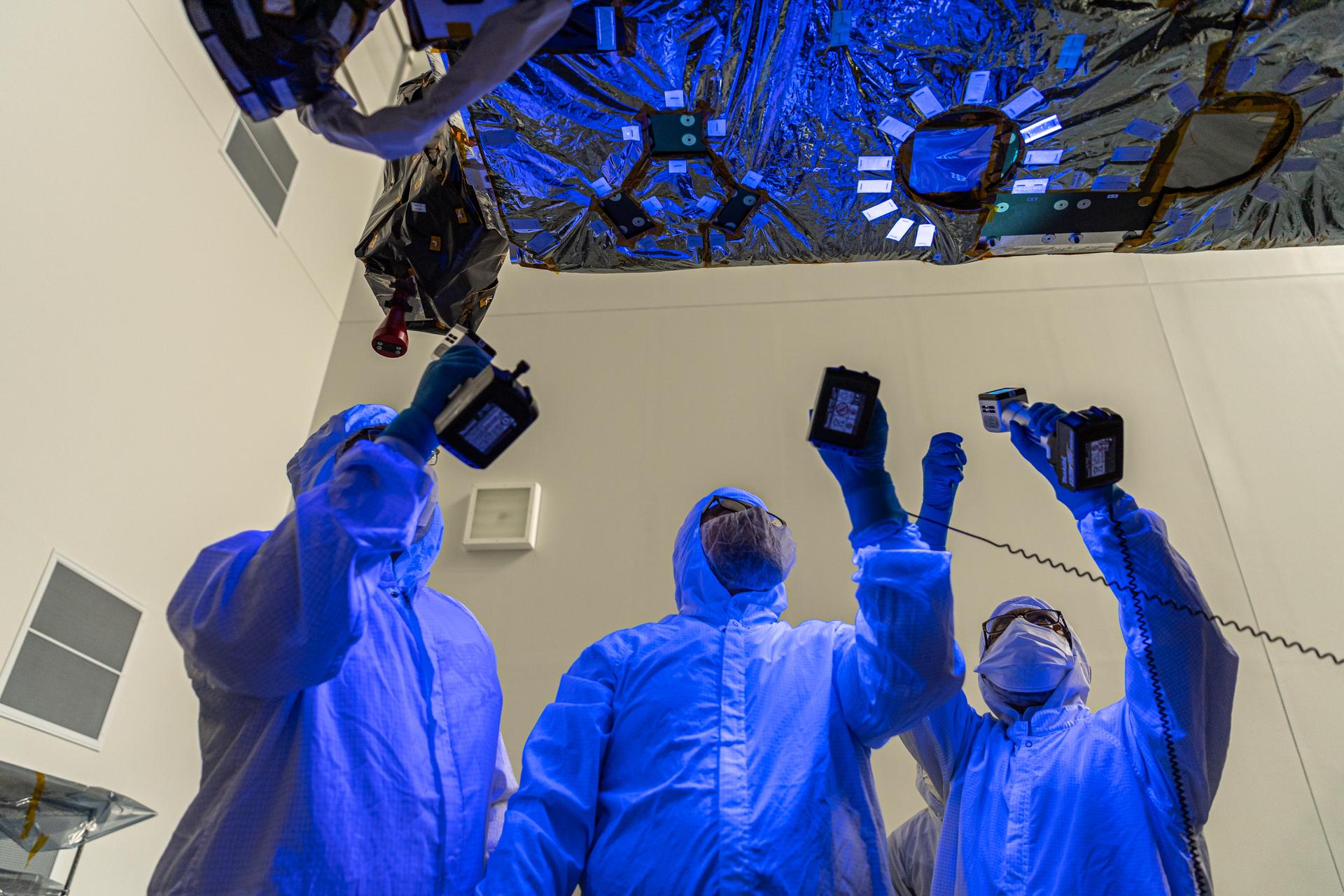 NASA Contamination and control engineers perform a blacklight inspection on the OSAM-1 Spacecraft Bus at Goddard Space Flight Center, Greenbelt Md., Sept 30, 2023. This photo has been reviewed by OSAM1 project management, Maxar public release authority, and the Export Control Office and is released for public view. NASA/Mike Guinto