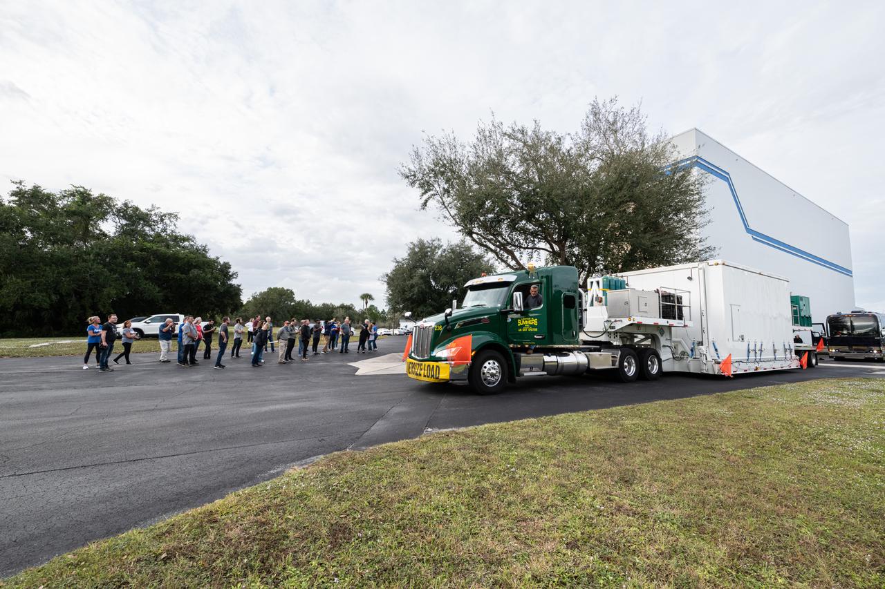 The transport carrier containing NASA’s Plankton, Aerosol, Cloud, ocean Ecosystem (PACE) observatory spacecraft arrives at the Astrotech Space Operations Facility near the agency’s Kennedy Space Center in Florida on Tuesday, Nov. 14, 2023. PACE was shipped from the agency’s Goddard Space Flight Center in Greenbelt, Maryland, and is targeted to launch on January 30, 2024, on a SpaceX Falcon 9 rocket lifting off from Space Launch Complex 40 at Cape Canaveral Space Force Station. The PACE observatory will help us better understand how the ocean and atmosphere exchange carbon dioxide, measure key atmospheric variables associated with air quality and Earth's climate, and monitor ocean health, in part by studying phytoplankton, tiny plants and algae that sustain the marine food web.