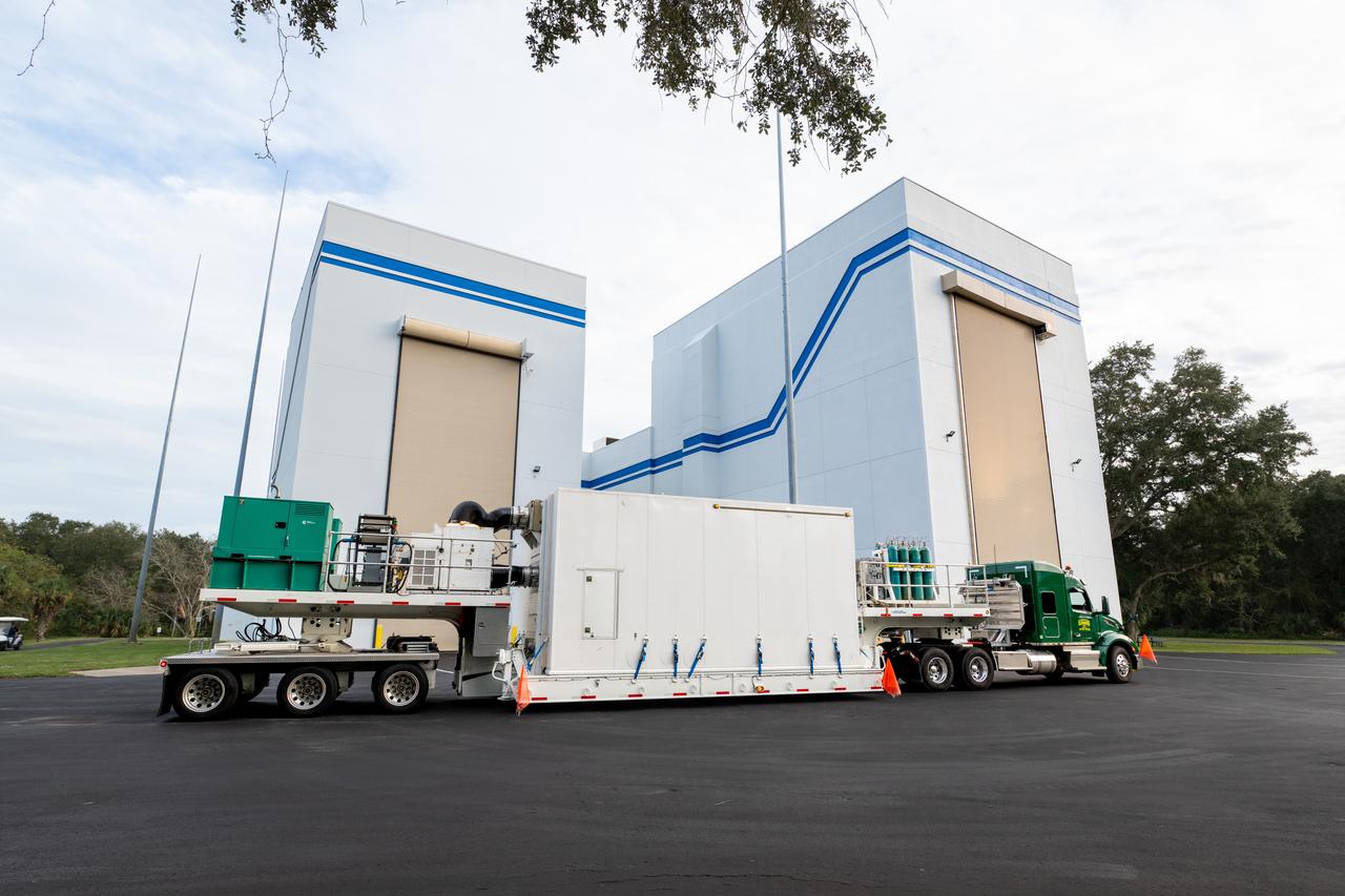 The transport carrier containing NASA’s Plankton, Aerosol, Cloud, ocean Ecosystem (PACE) observatory spacecraft arrives at the Astrotech Space Operations Facility near the agency’s Kennedy Space Center in Florida on Tuesday, Nov. 14, 2023. PACE was shipped from the agency’s Goddard Space Flight Center in Greenbelt, Maryland, and is targeted to launch on January 30, 2024, on a SpaceX Falcon 9 rocket lifting off from Space Launch Complex 40 at Cape Canaveral Space Force Station. The PACE observatory will help us better understand how the ocean and atmosphere exchange carbon dioxide, measure key atmospheric variables associated with air quality and Earth's climate, and monitor ocean health, in part by studying phytoplankton, tiny plants and algae that sustain the marine food web.