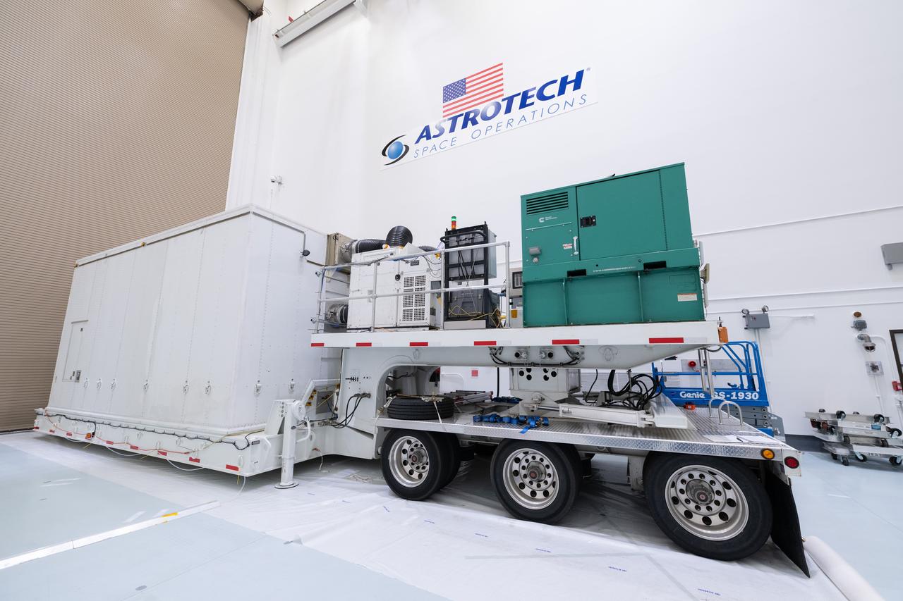 The transport carrier containing NASA’s Plankton, Aerosol, Cloud, ocean Ecosystem (PACE) observatory spacecraft arrives at the Astrotech Space Operations Facility near the agency’s Kennedy Space Center in Florida on Tuesday, Nov. 14, 2023. PACE was shipped from the agency’s Goddard Space Flight Center in Greenbelt, Maryland, and is targeted to launch on January 30, 2024, on a SpaceX Falcon 9 rocket lifting off from Space Launch Complex 40 at Cape Canaveral Space Force Station. The PACE observatory will help us better understand how the ocean and atmosphere exchange carbon dioxide, measure key atmospheric variables associated with air quality and Earth's climate, and monitor ocean health, in part by studying phytoplankton, tiny plants and algae that sustain the marine food web.