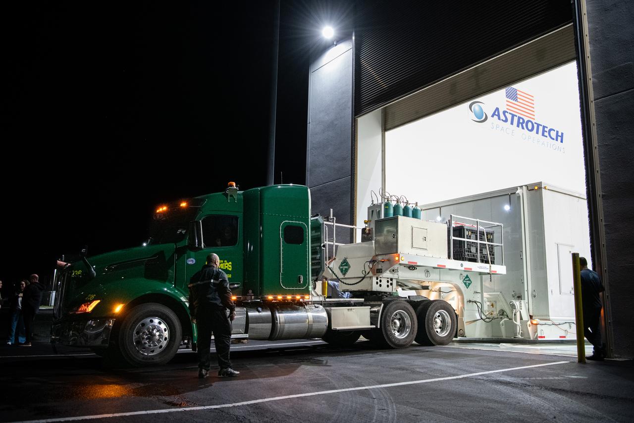The transport carrier containing NASA’s Plankton, Aerosol, Cloud, ocean Ecosystem (PACE) observatory spacecraft arrives at the Astrotech Space Operations Facility near the agency’s Kennedy Space Center in Florida on Tuesday, Nov. 14, 2023. PACE was shipped from the agency’s Goddard Space Flight Center in Greenbelt, Maryland, and is targeted to launch on January 30, 2024, on a SpaceX Falcon 9 rocket lifting off from Space Launch Complex 40 at Cape Canaveral Space Force Station. The PACE observatory will help us better understand how the ocean and atmosphere exchange carbon dioxide, measure key atmospheric variables associated with air quality and Earth's climate, and monitor ocean health, in part by studying phytoplankton, tiny plants and algae that sustain the marine food web.