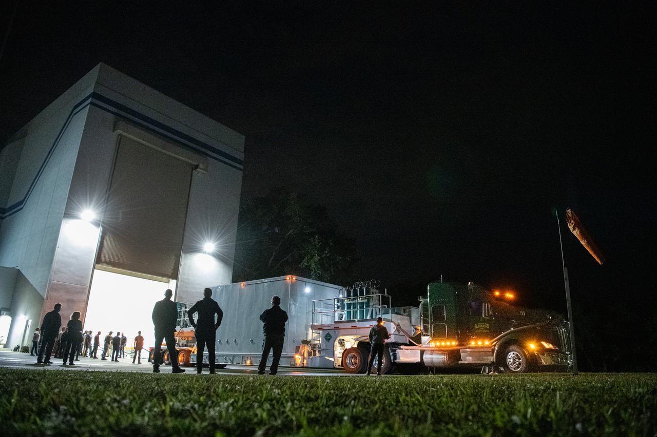 The transport carrier containing NASA’s Plankton, Aerosol, Cloud, ocean Ecosystem (PACE) observatory spacecraft arrives at the Astrotech Space Operations Facility near the agency’s Kennedy Space Center in Florida on Tuesday, Nov. 14, 2023. PACE was shipped from the agency’s Goddard Space Flight Center in Greenbelt, Maryland, and is targeted to launch on January 30, 2024, on a SpaceX Falcon 9 rocket lifting off from Space Launch Complex 40 at Cape Canaveral Space Force Station. The PACE observatory will help us better understand how the ocean and atmosphere exchange carbon dioxide, measure key atmospheric variables associated with air quality and Earth's climate, and monitor ocean health, in part by studying phytoplankton, tiny plants and algae that sustain the marine food web.
