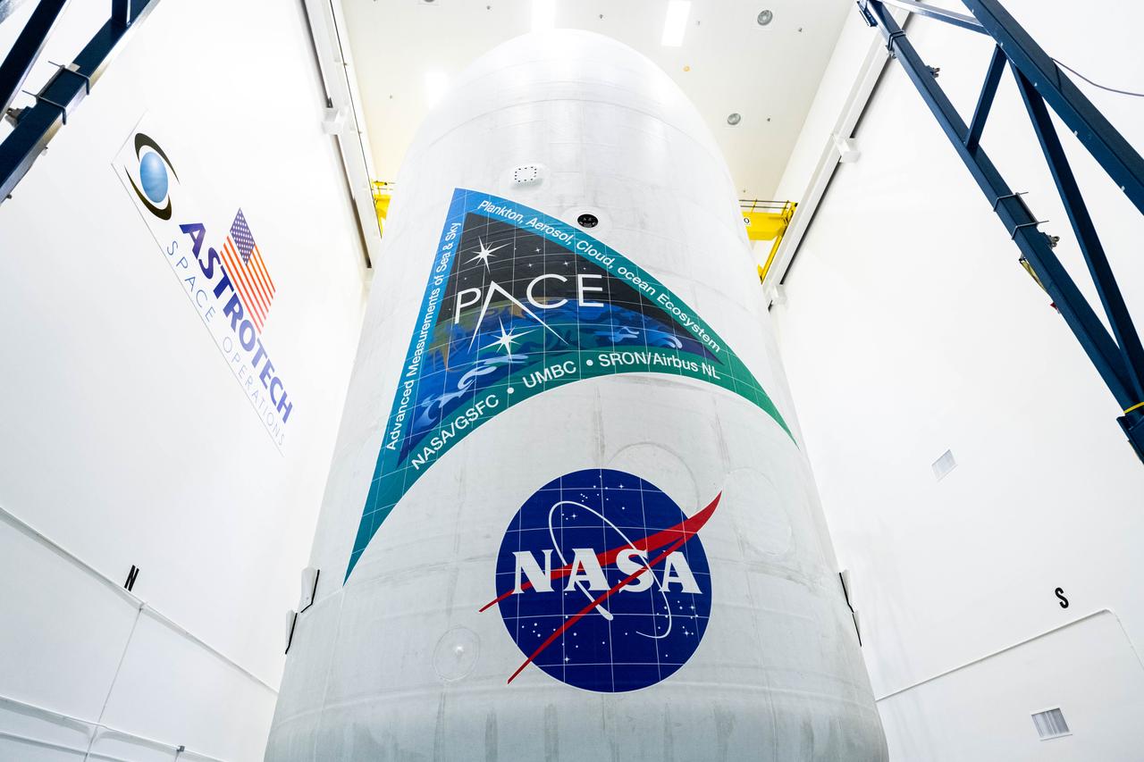 NASA and SpaceX technicians safely encapsulate NASA’s PACE (Plankton, Aerosol, Cloud, ocean Ecosystem) spacecraft in SpaceX’s Falcon 9 payload fairings on Wednesday, Jan. 30, 2024, at the Astrotech Space Operations Facility near the agency’s Kennedy Space Center in Florida. The fairing halves protect the spacecraft from aerodynamic pressure and heating during the ascent phase of launch. PACE is set to launch from Space Launch Complex 40 at Cape Canaveral Space Force Station in Florida no earlier than 1:33 a.m. EST on Tuesday, Feb. 6, 2024.