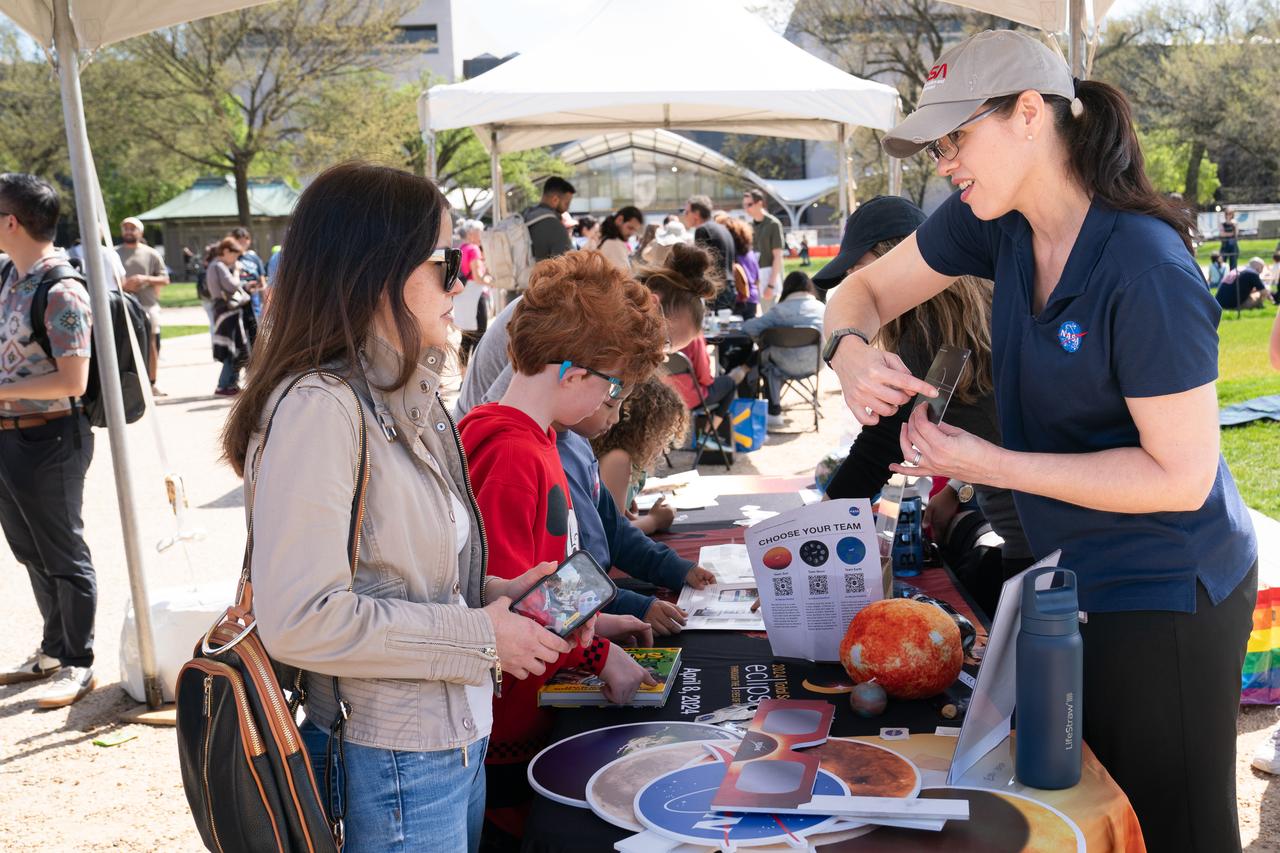 The NASA booth at the Eclipse Festival on the national mall during a partial solar eclipse in Washington, DC, Monday, April 8, 2024. A total solar eclipse swept across a narrow portion of the North American continent from Mexico’s Pacific coast to the Atlantic coast of Newfoundland, Canada. A partial solar eclipse was visible across the entire North American continent along with parts of Central America and Europe. Photo Credit: (NASA/Denny Henry)